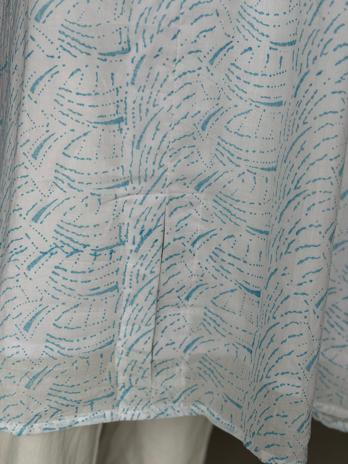 White A-line hand block printed soft cotton kurti with blue waves design