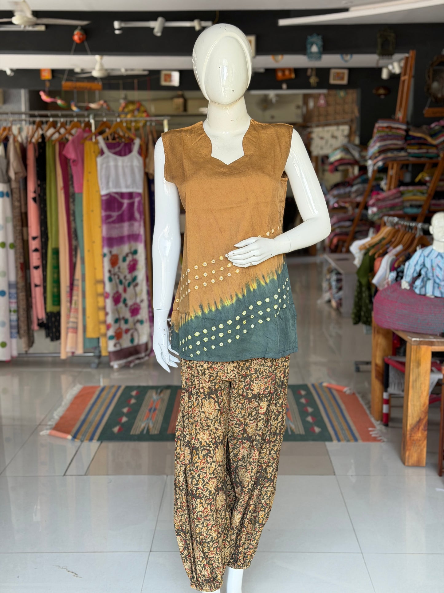 Olive green Kalamkari hand block printed cotton harem pants for women with elastic hem