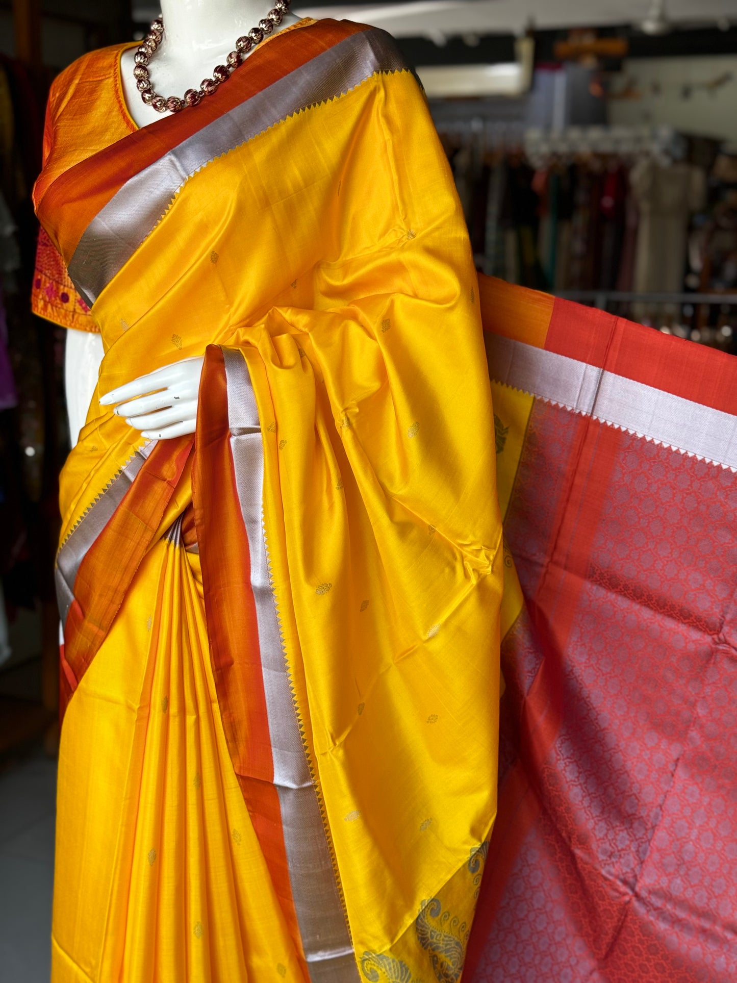 Haldi yellow pure silk Kodiyala handloom saree with all over gold butis and silver katan border