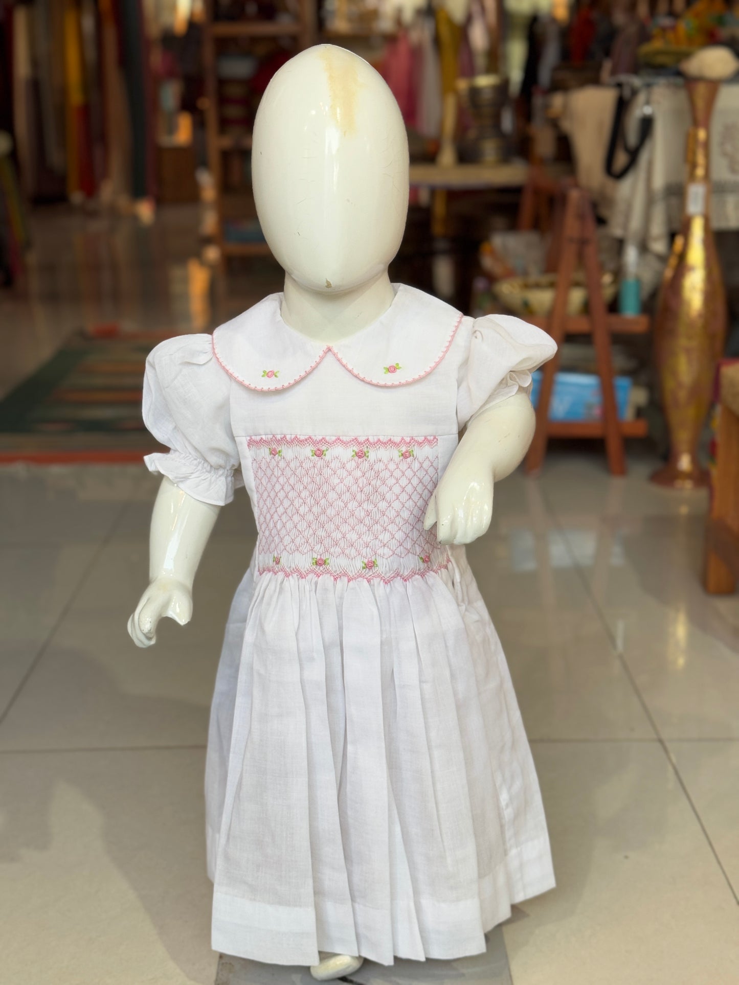 White smocking collared cotton frock with hand embroidery and waist tie