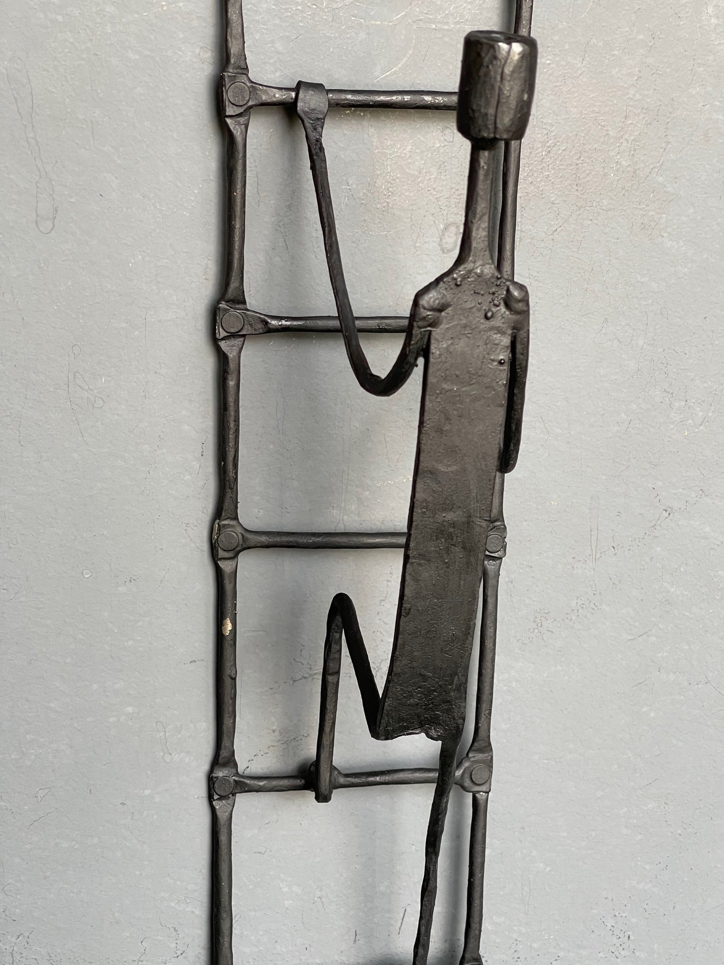 Person climbing ladder - handcrafted wrought iron