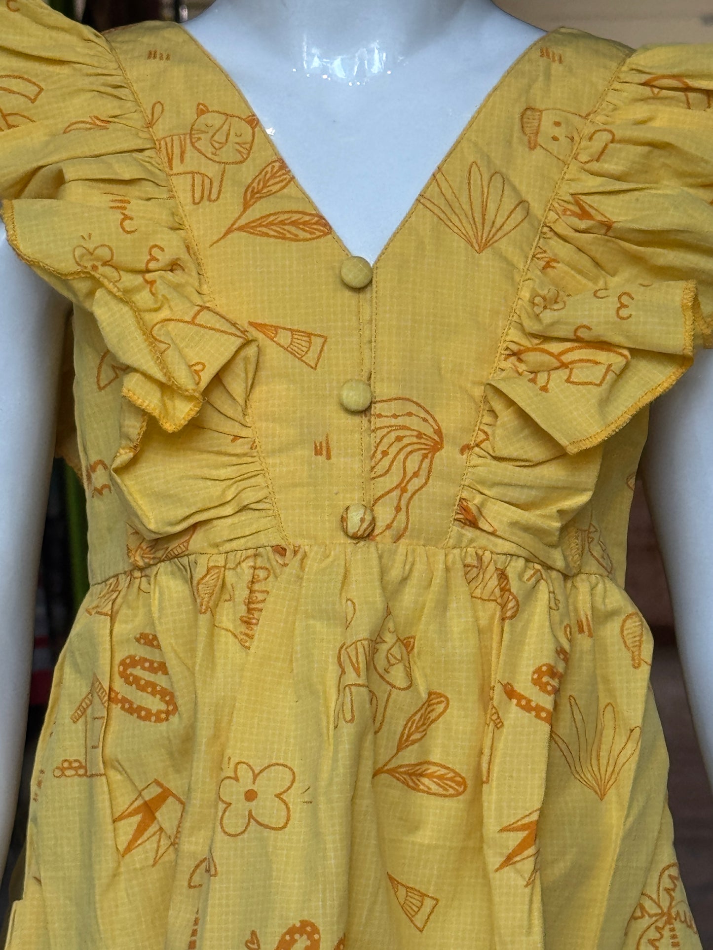 Yellow printed V-neck and flared sleeved frock for girls