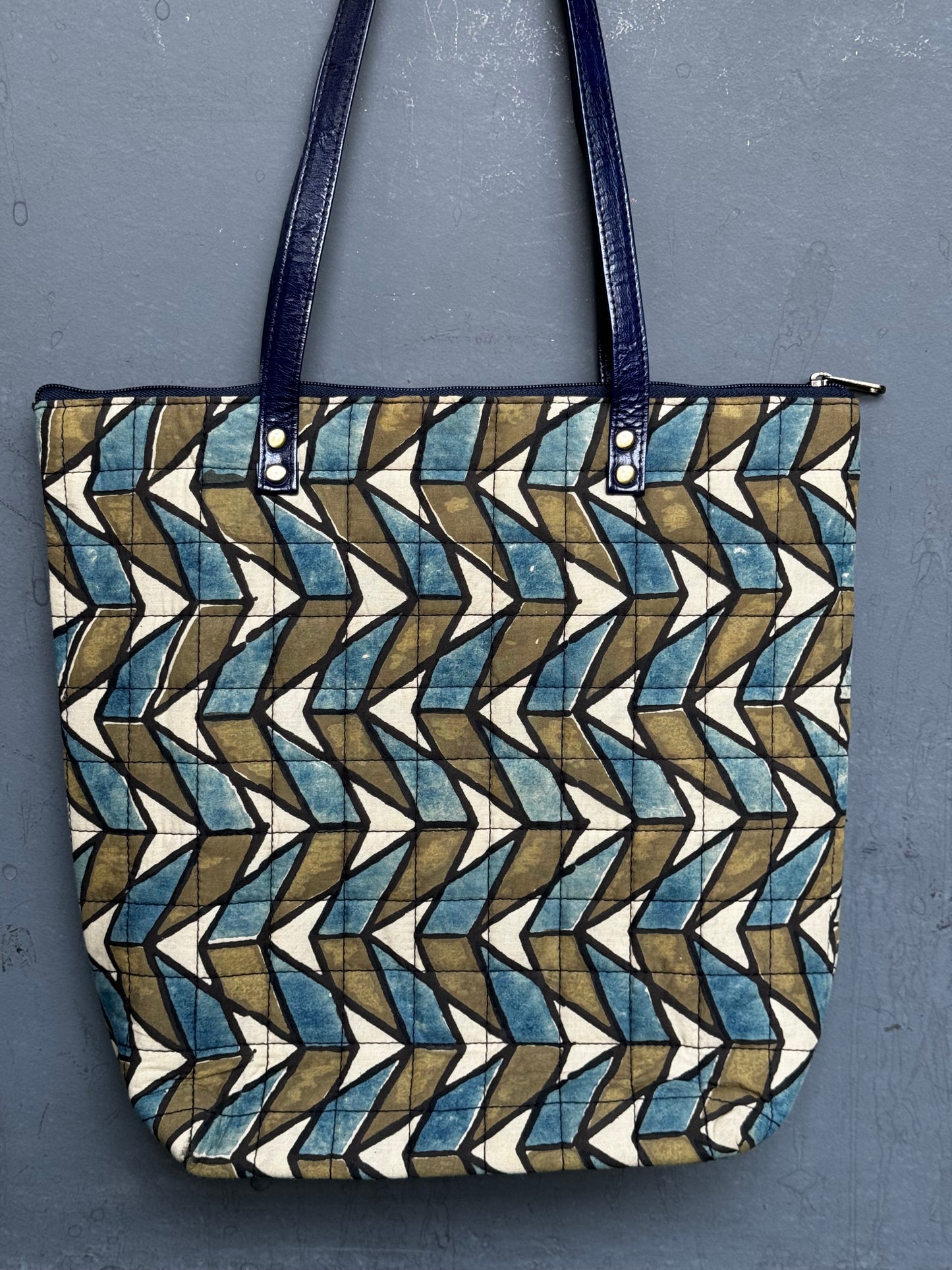 Quilted hand block printed, hand crafted fabric tote bag with front pocket and leather handles