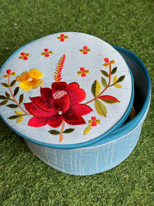 Blue fabric jar gift hamper with flowers embroidery with zipper closure lid
