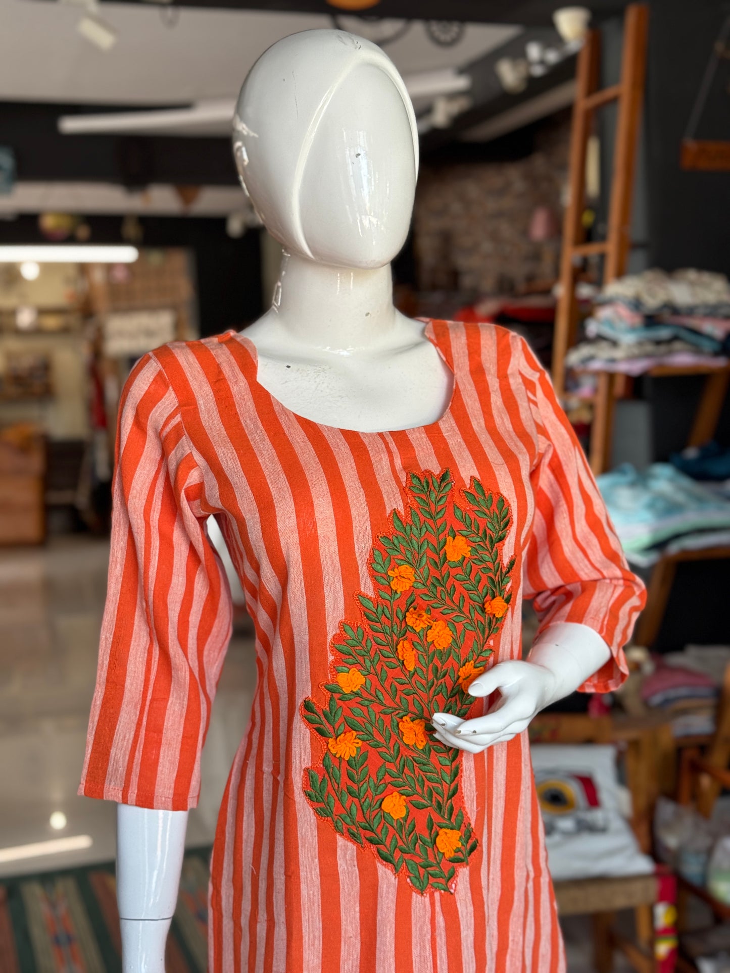 Bright orange stripes handwoven kala cotton straight kurti with leaves and flowers embroidery on the front