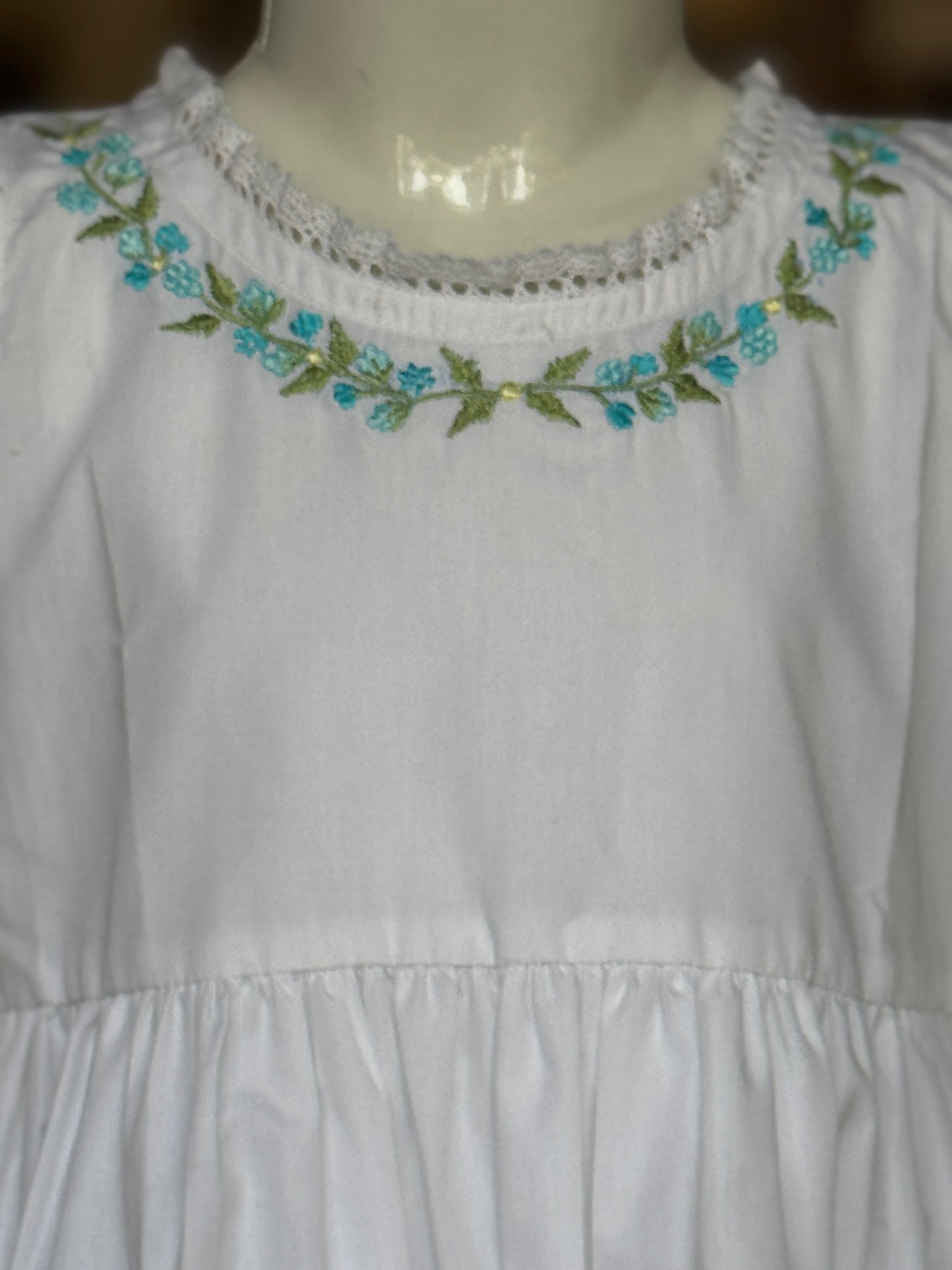 White floral embroidered cotton sleeveless frock with lace trims