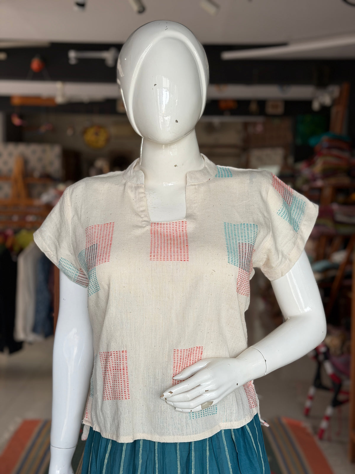 Off white hand woven cotton top with orange and teal woven squares