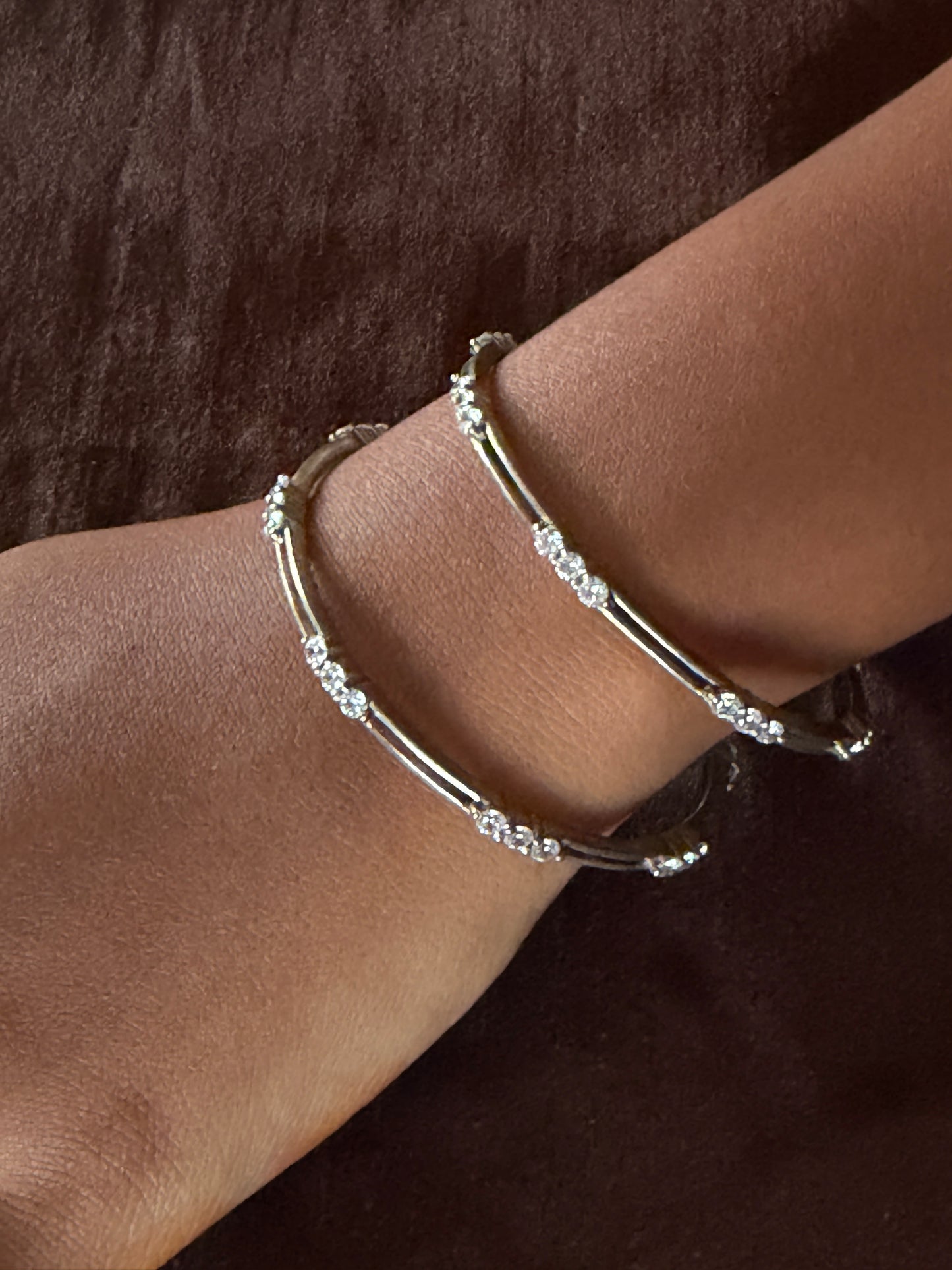 Silver bangles pair with white stone between 2 lines