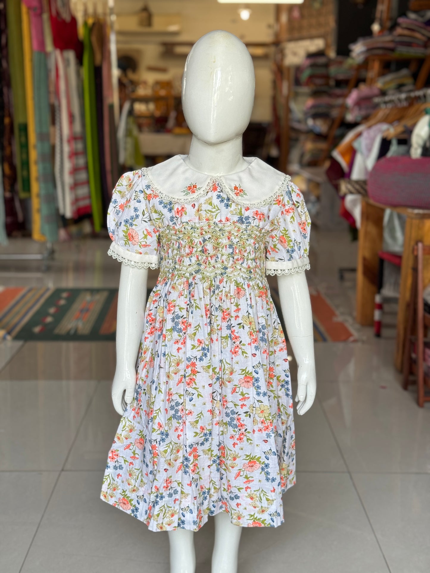 White floral print hand embroidered smocking cotton frock for girls with collar and lace trims
