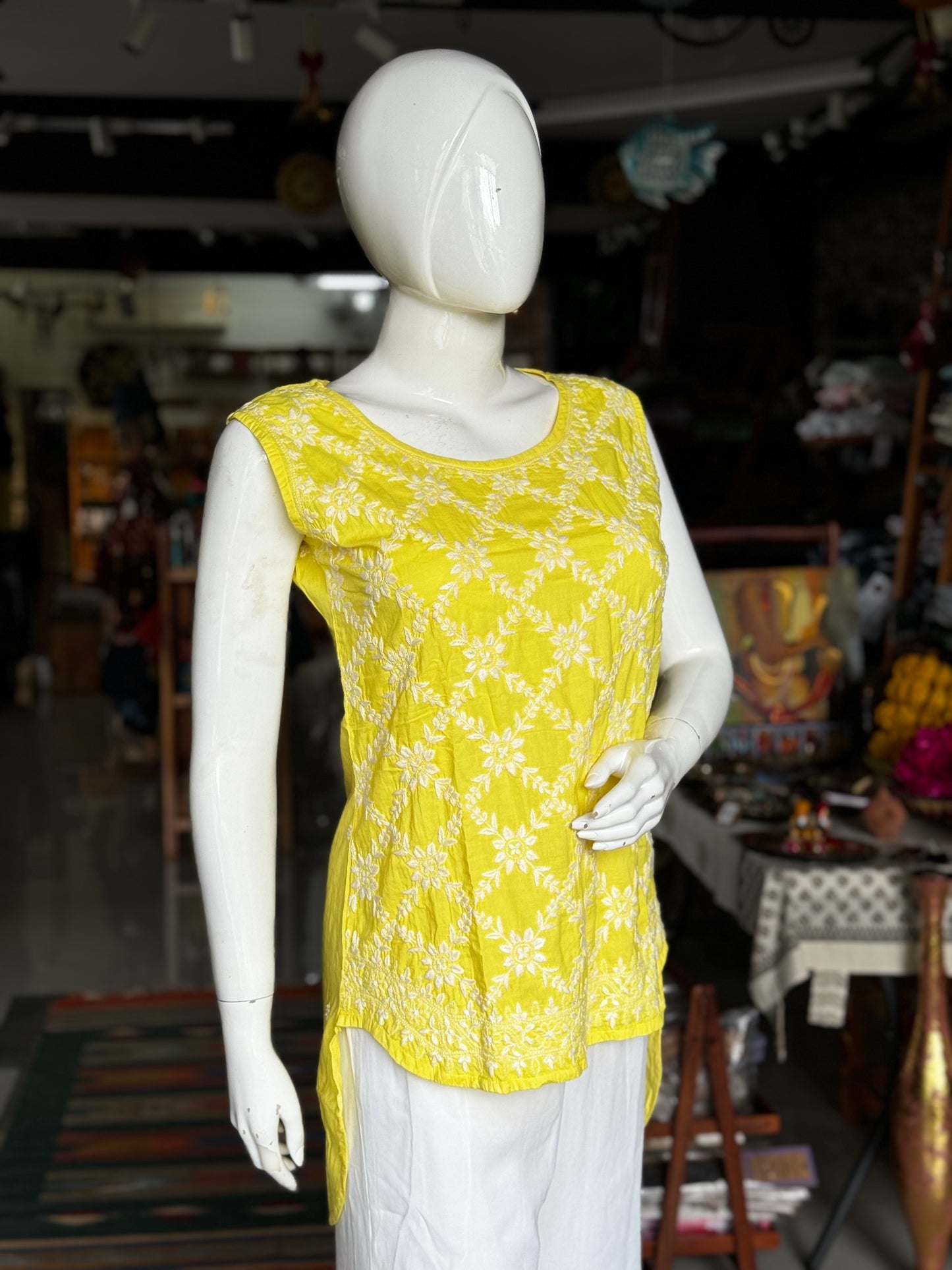 Lemon yellow cotton Chikankari hand embroidered sleeveless high low top with back buttons