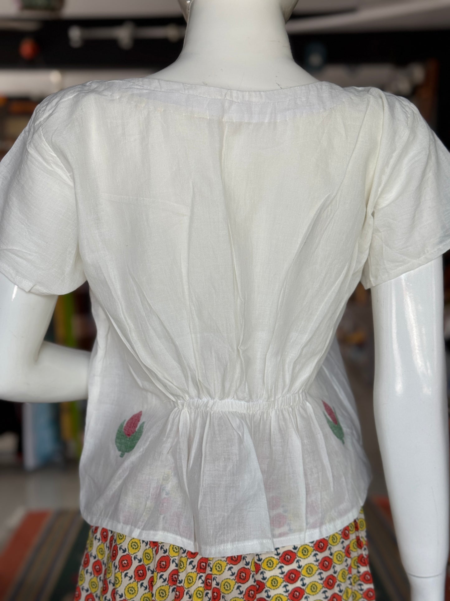 White Jamdani cotton handloom top with bird and flower motif on the front and back with elastic detailing