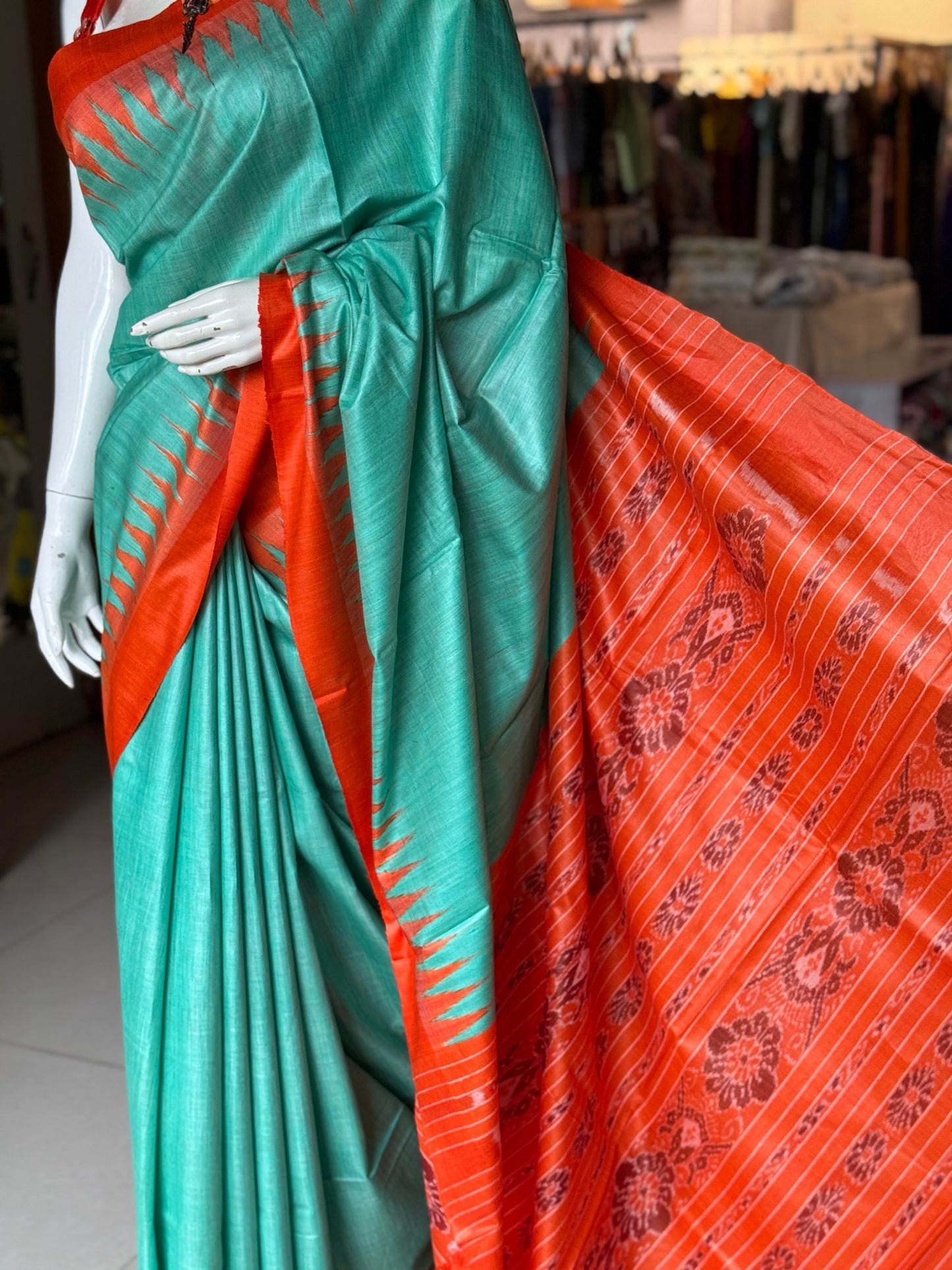 Sea green and orange tussar handwoven saree with ikat palla