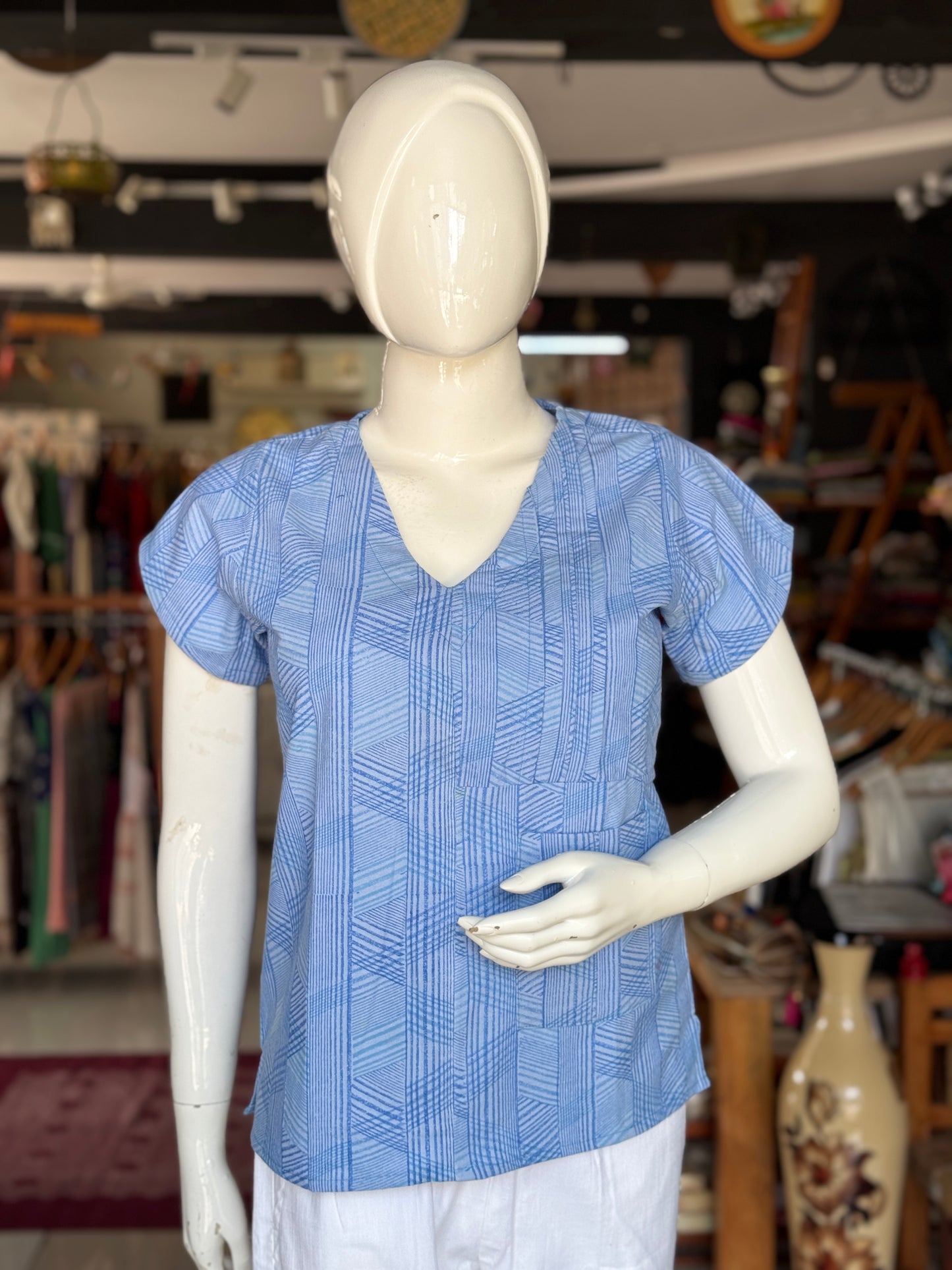 Blue geometric hand block printed cotton top with asymmetric pintucks and one side pocket