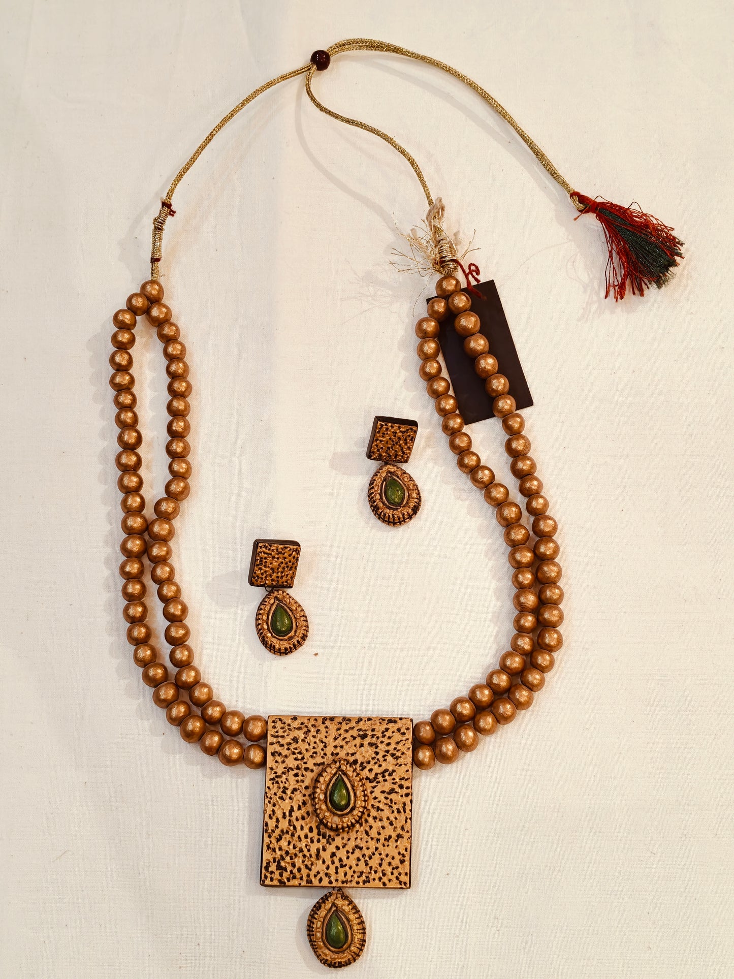 2 layered golden terracotta beads with green accents neckpiece, earrings set