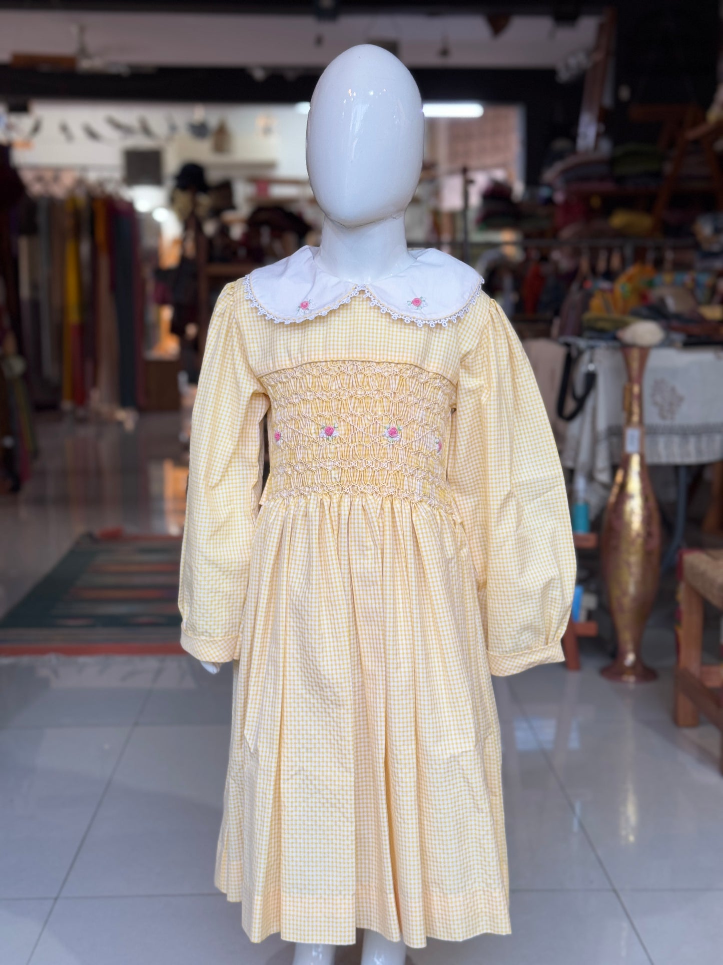 Yellow checks smocking cotton frock with embroidered collar and long sleeves