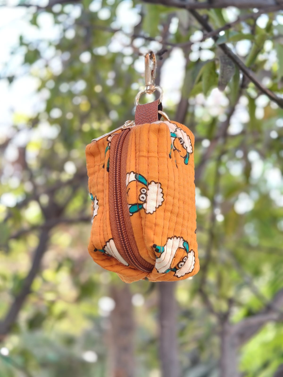Coin pouch in soft quilted hand block printed cotton with zipper closure and hanging loop - multiple designs available