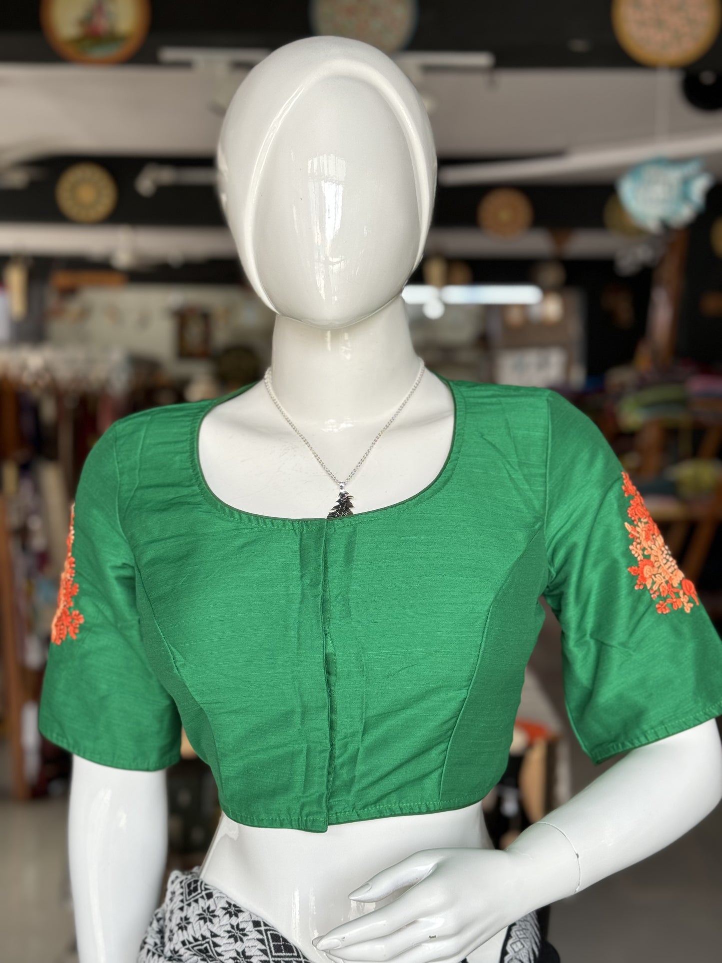 Green silk blouse with hand embroidered flowers