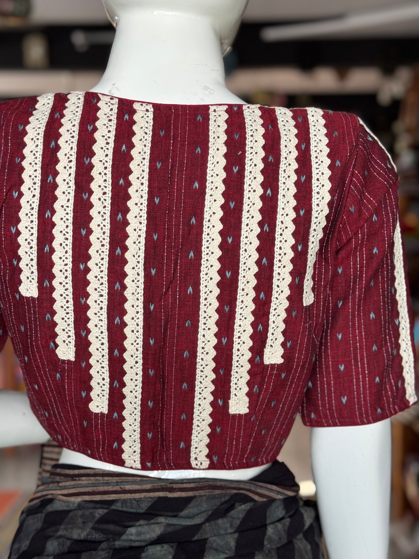 Maroon cotton blouse with multiple lace lines on back, sleeves and front