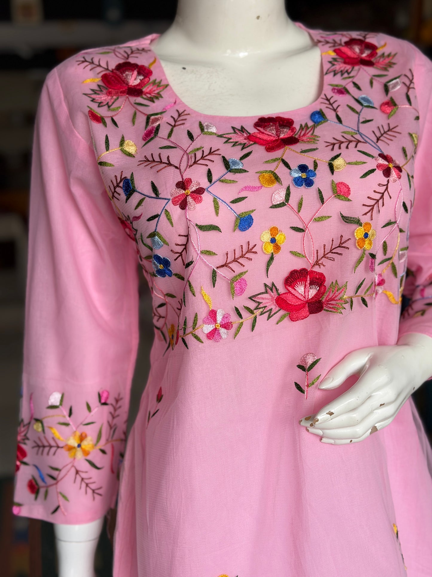 Pink hand embroidered floral design a-line net kurti