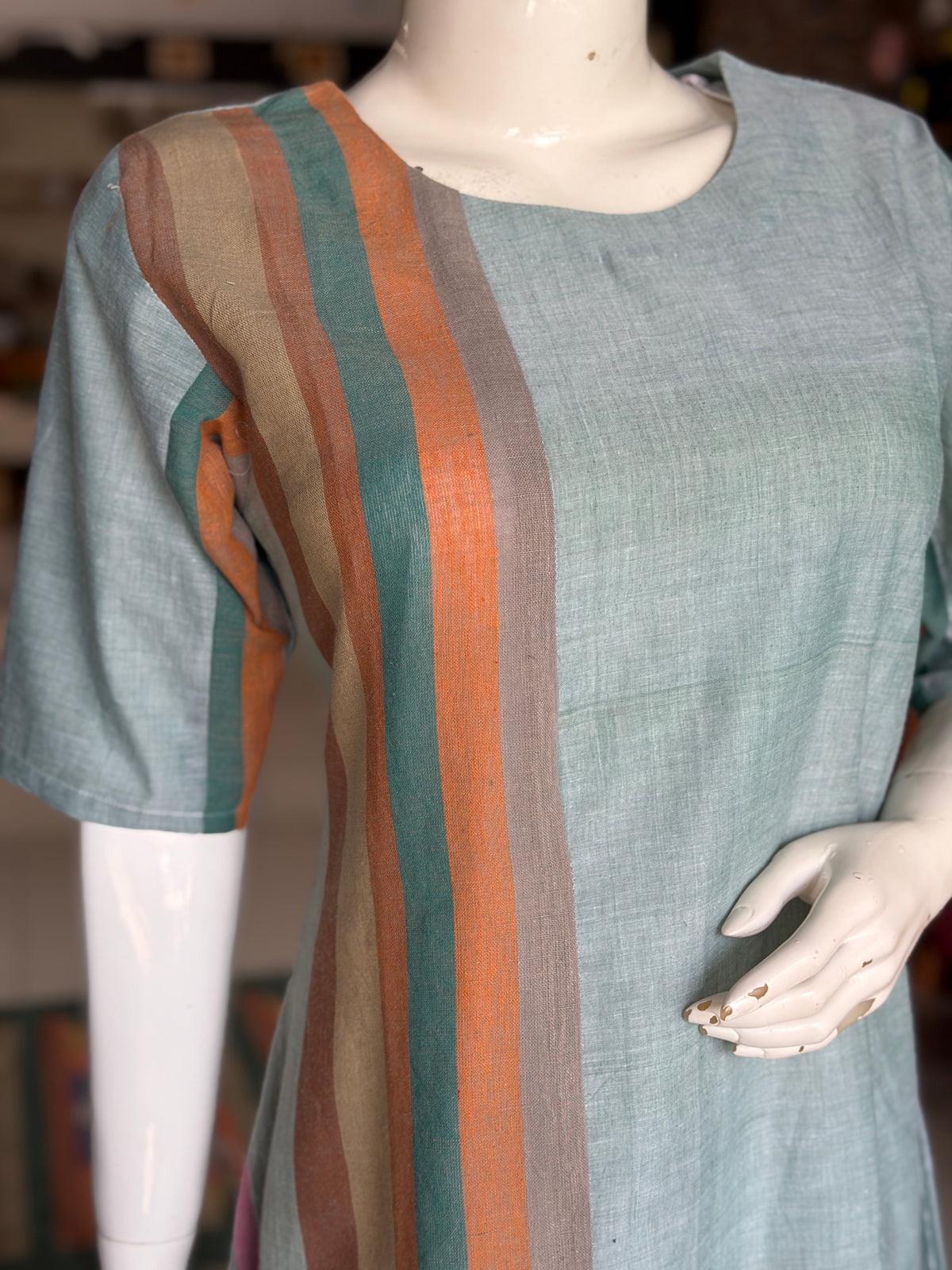 Green handloom cotton dress with hand woven kala cotton stripes on one side
