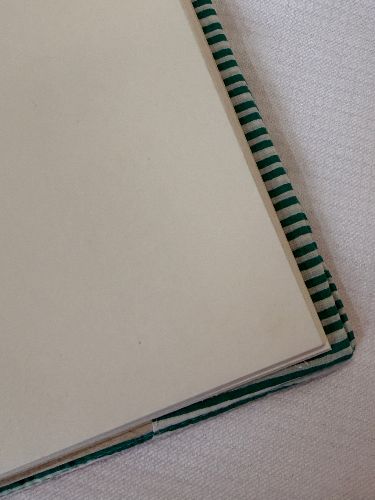 Beige hand embroidered reusable fabric cover / book sleeve with journal notebook inside