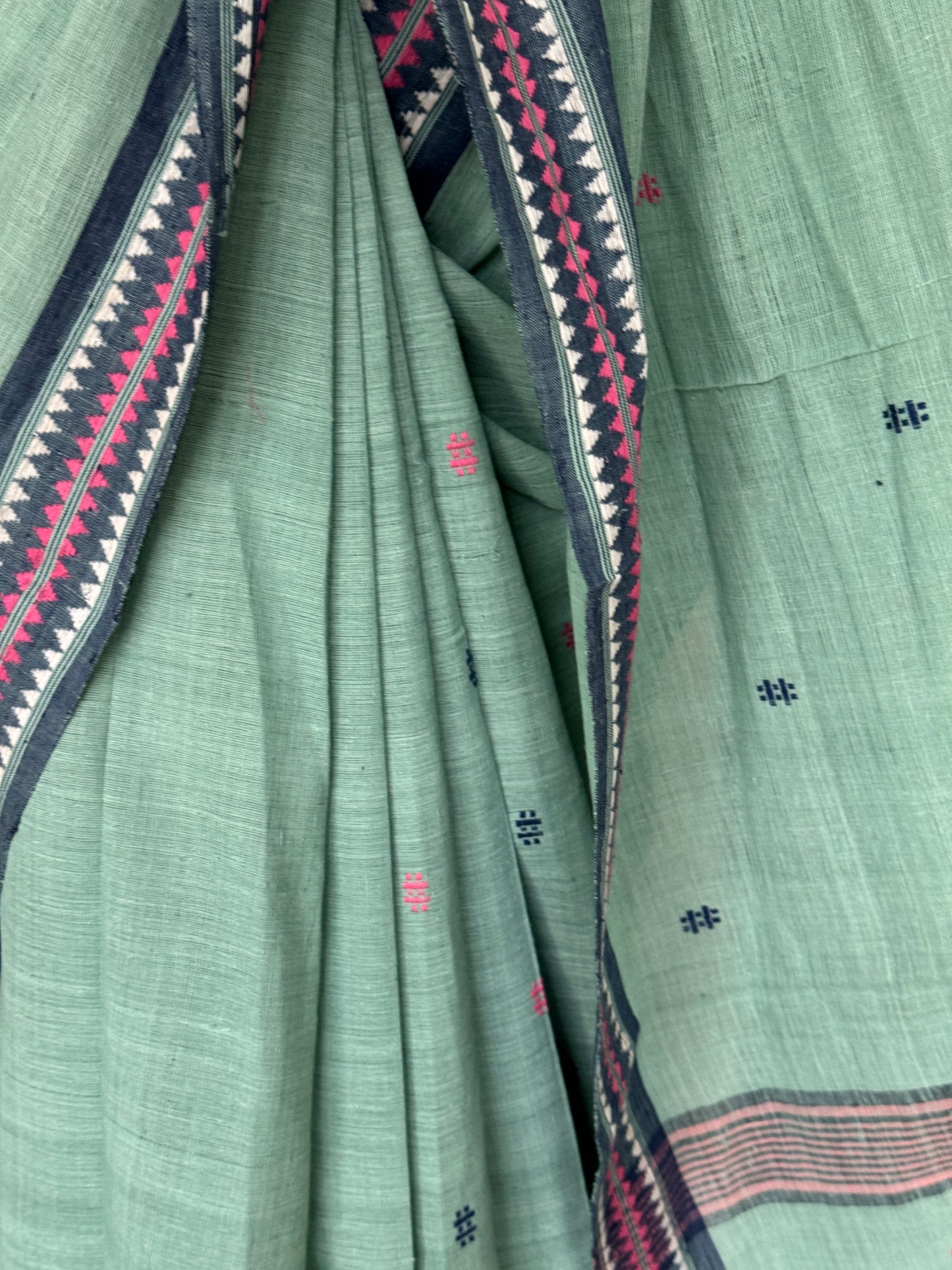 Pastel bluish green coarse textured handloom cotton saree with small butis and thread border