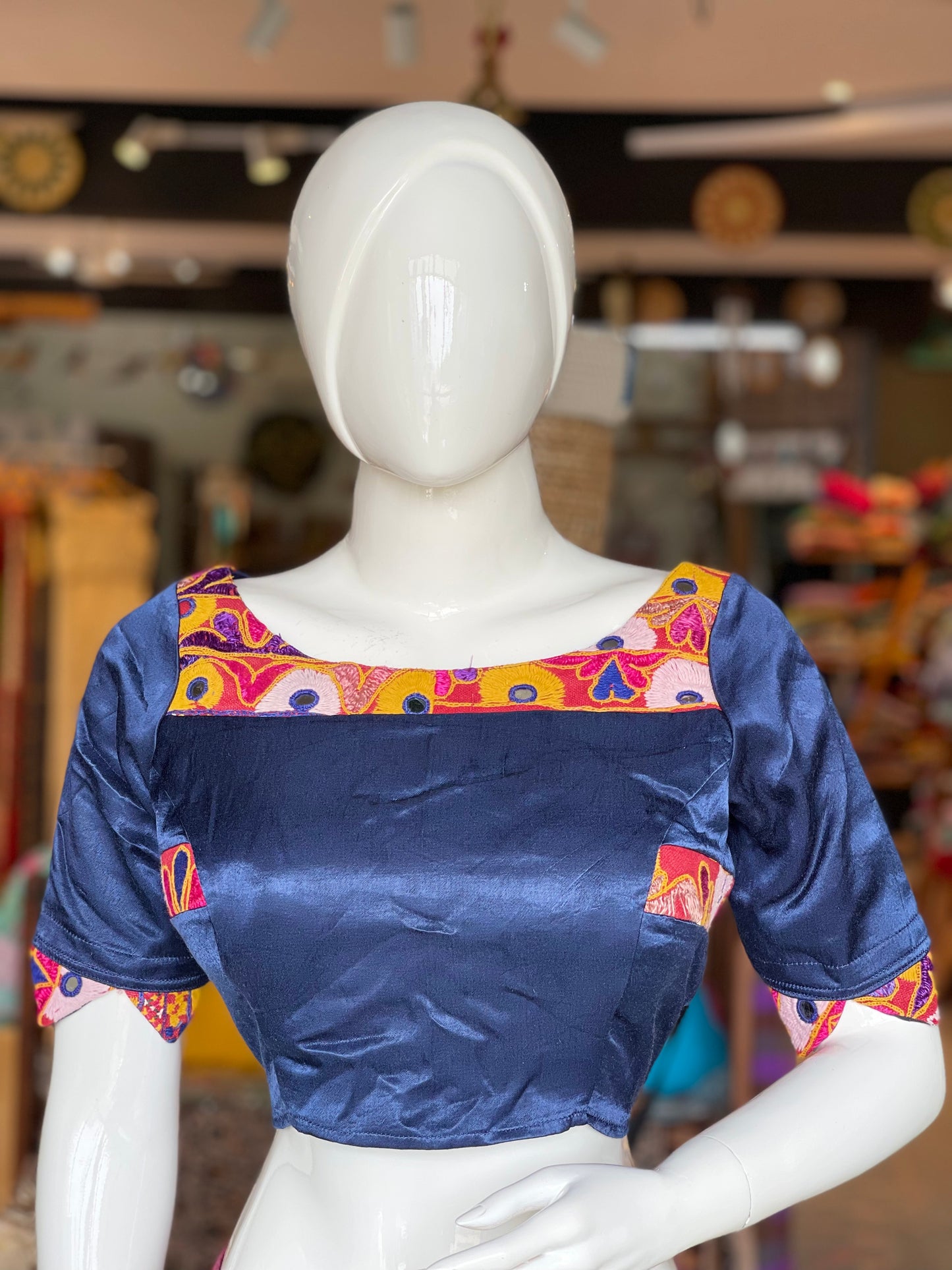 Blue mashru blouse with hand embroidery on front neckline and triangular sleeve hems