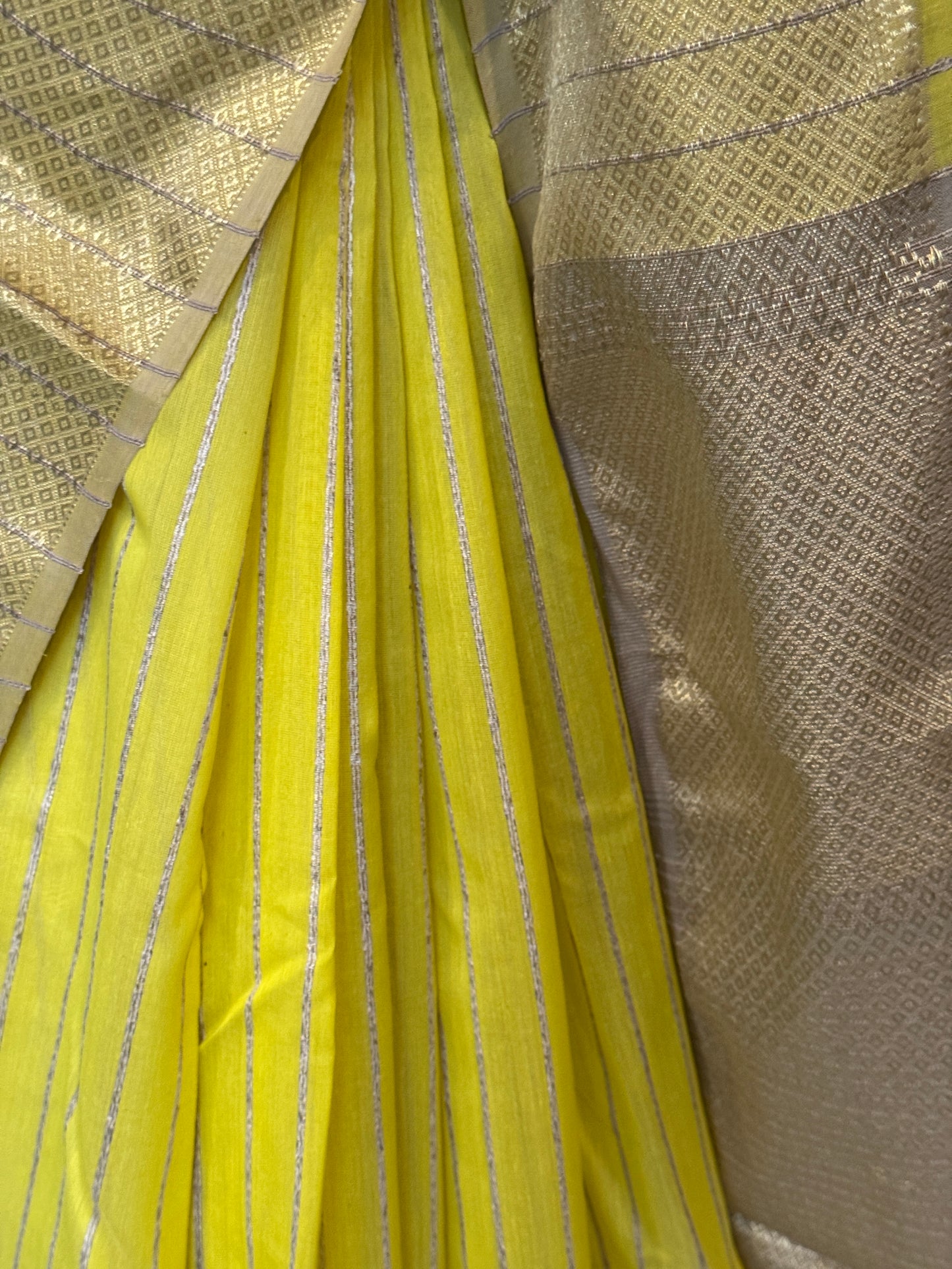 Yellow silk cotton Maheshwari handloom saree with zari pallu and vertical stripes all over