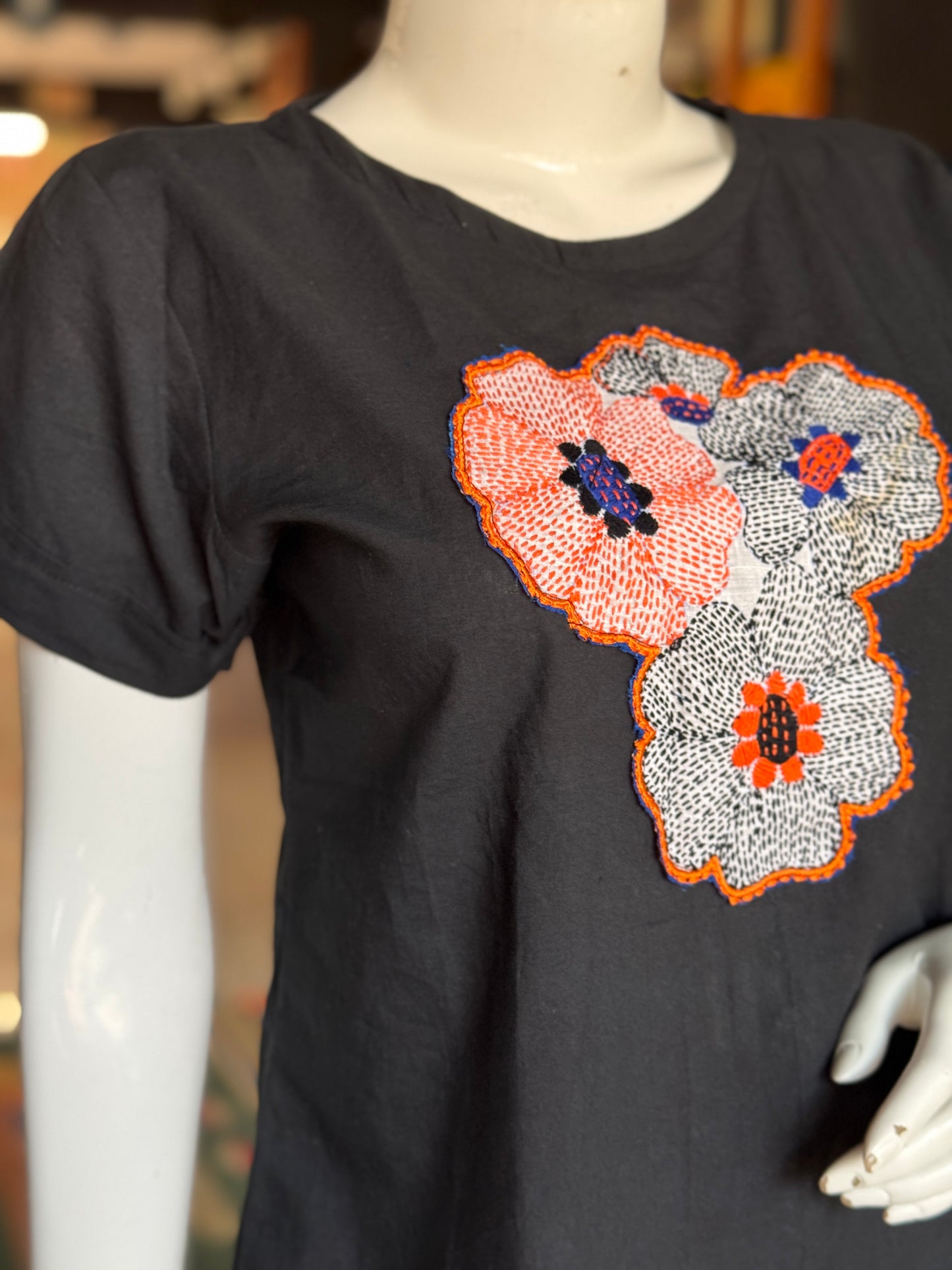 Black cotton top with hand embroidery on the front