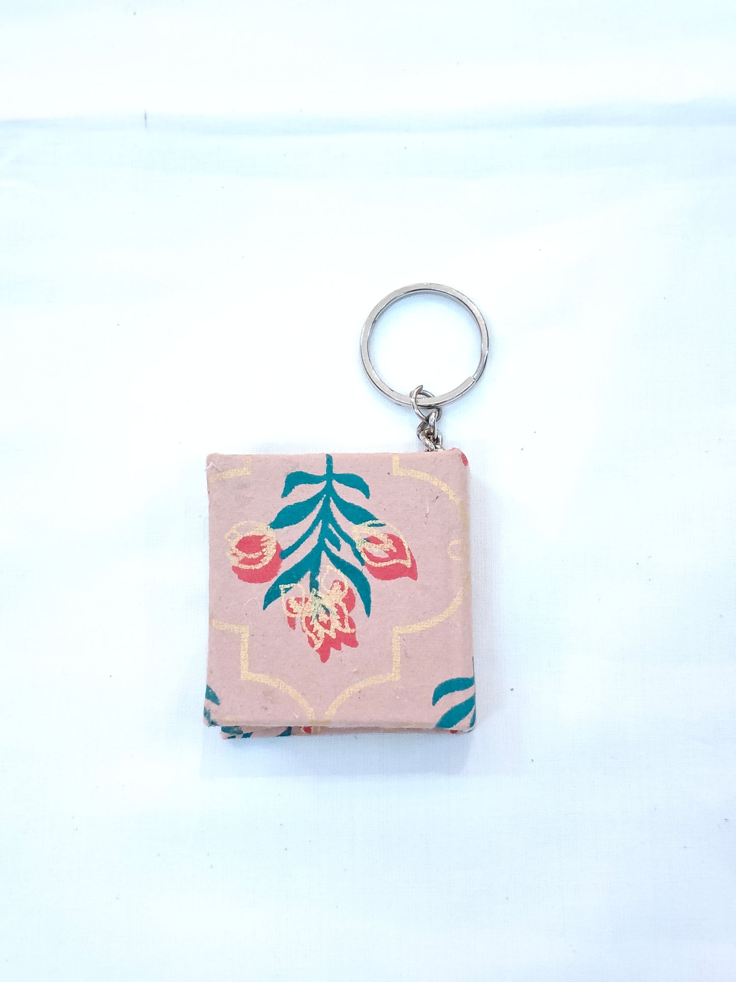 Key ring with small hand made paper notebook