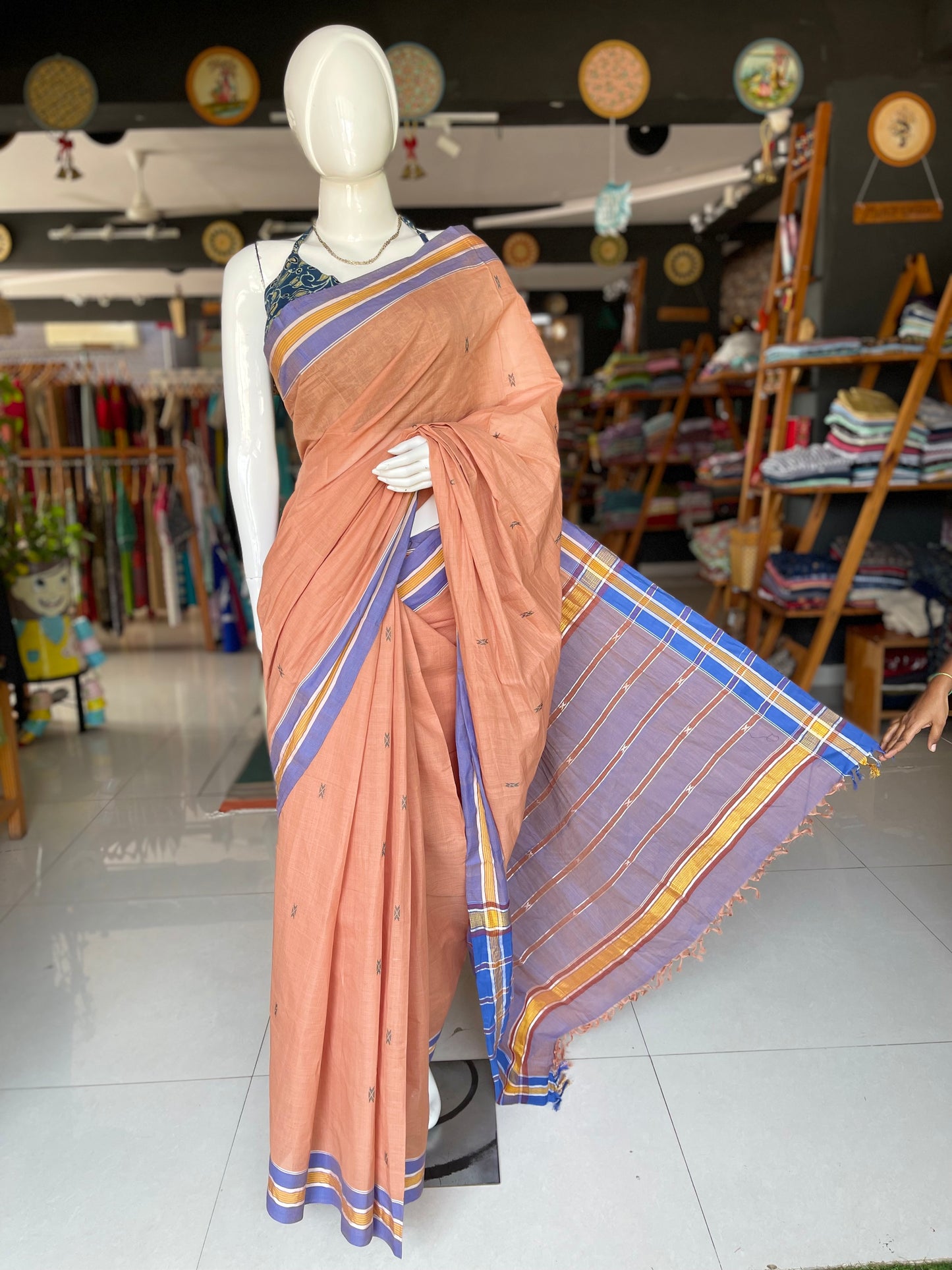 Peach handwoven cotton saree with butis all over and stripes palla