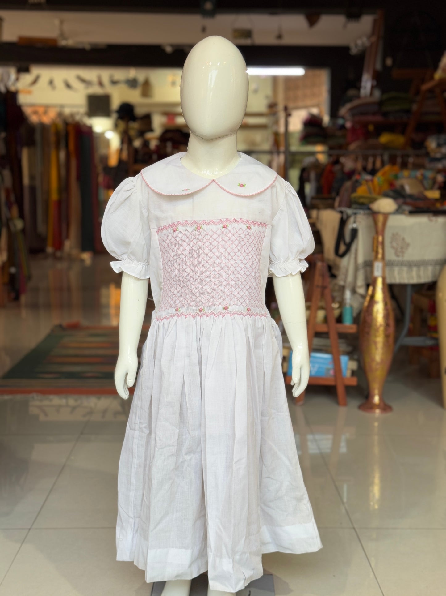 White smocking collared cotton frock with hand embroidery and waist tie