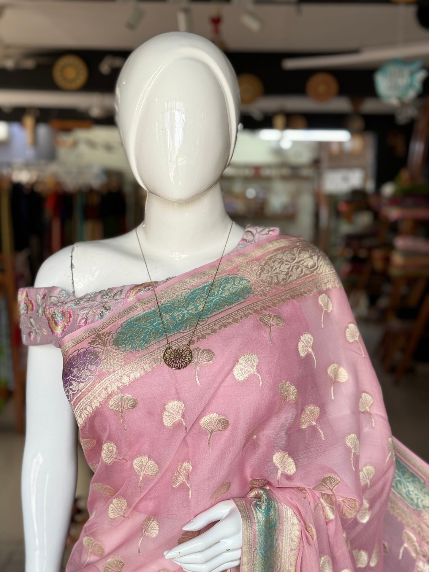 Light pink Banarasi georgette saree with colorful painted border