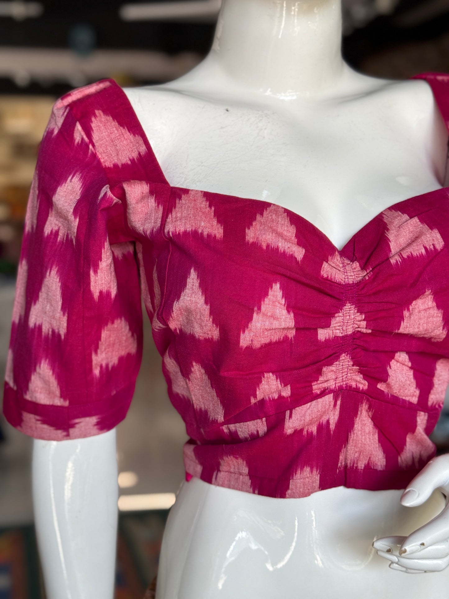 Dark pink triangular design cotton fancy ikat blouse