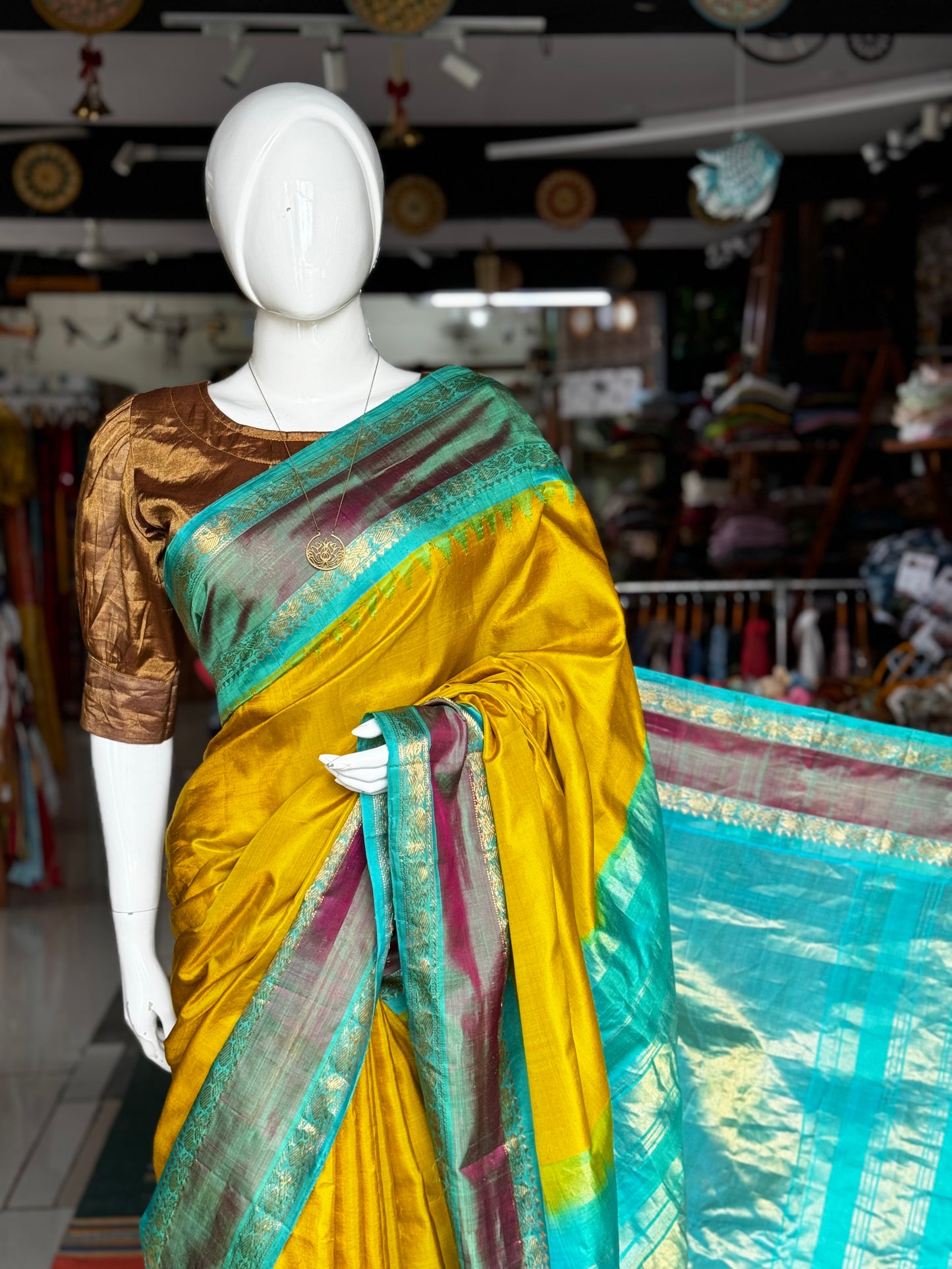 Beautiful mustard and green combination pure silk handwoven Gadwal saree with temple borders