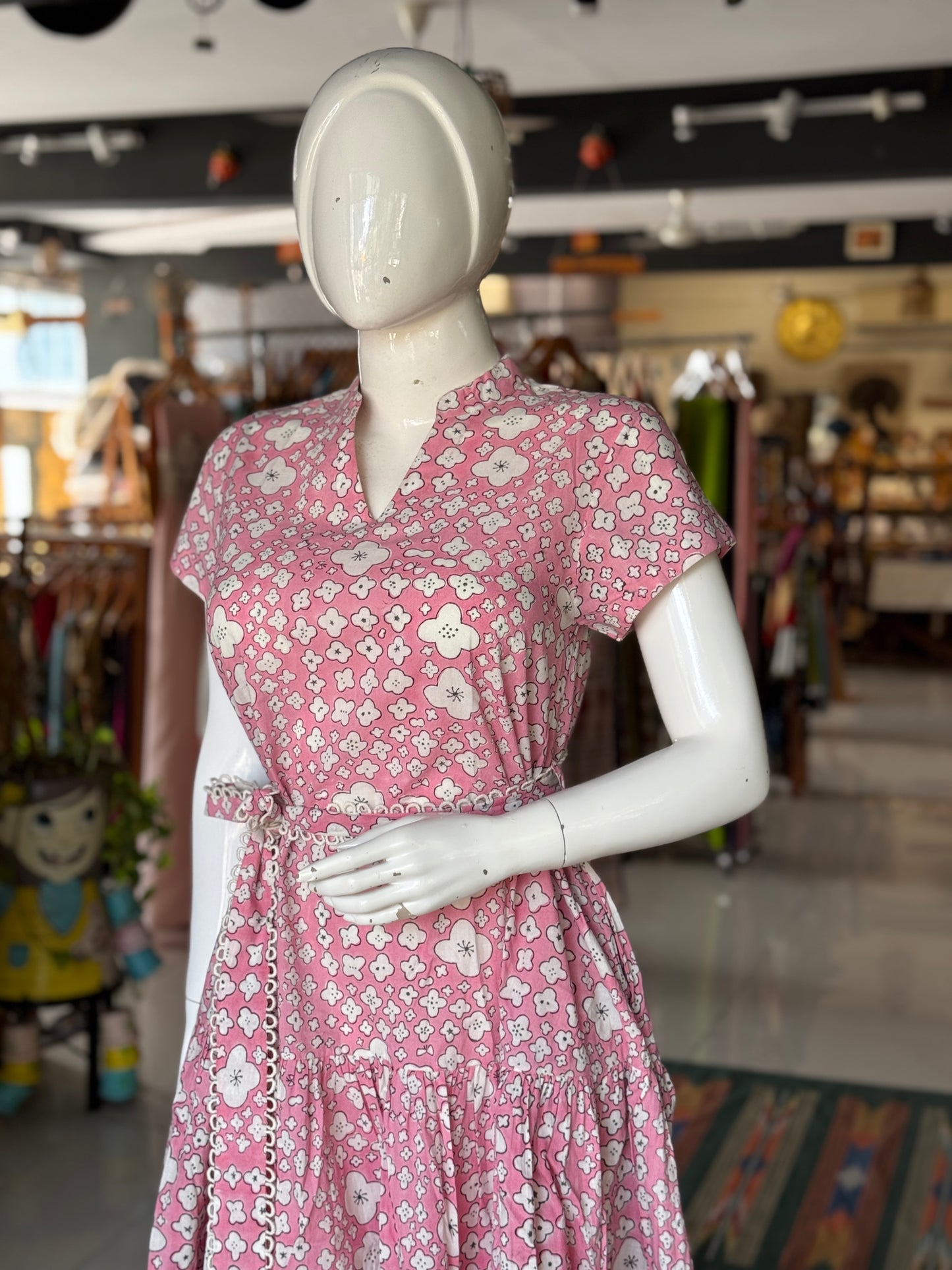 Pink cotton hand block printed tiered dress with belt and lace detailing