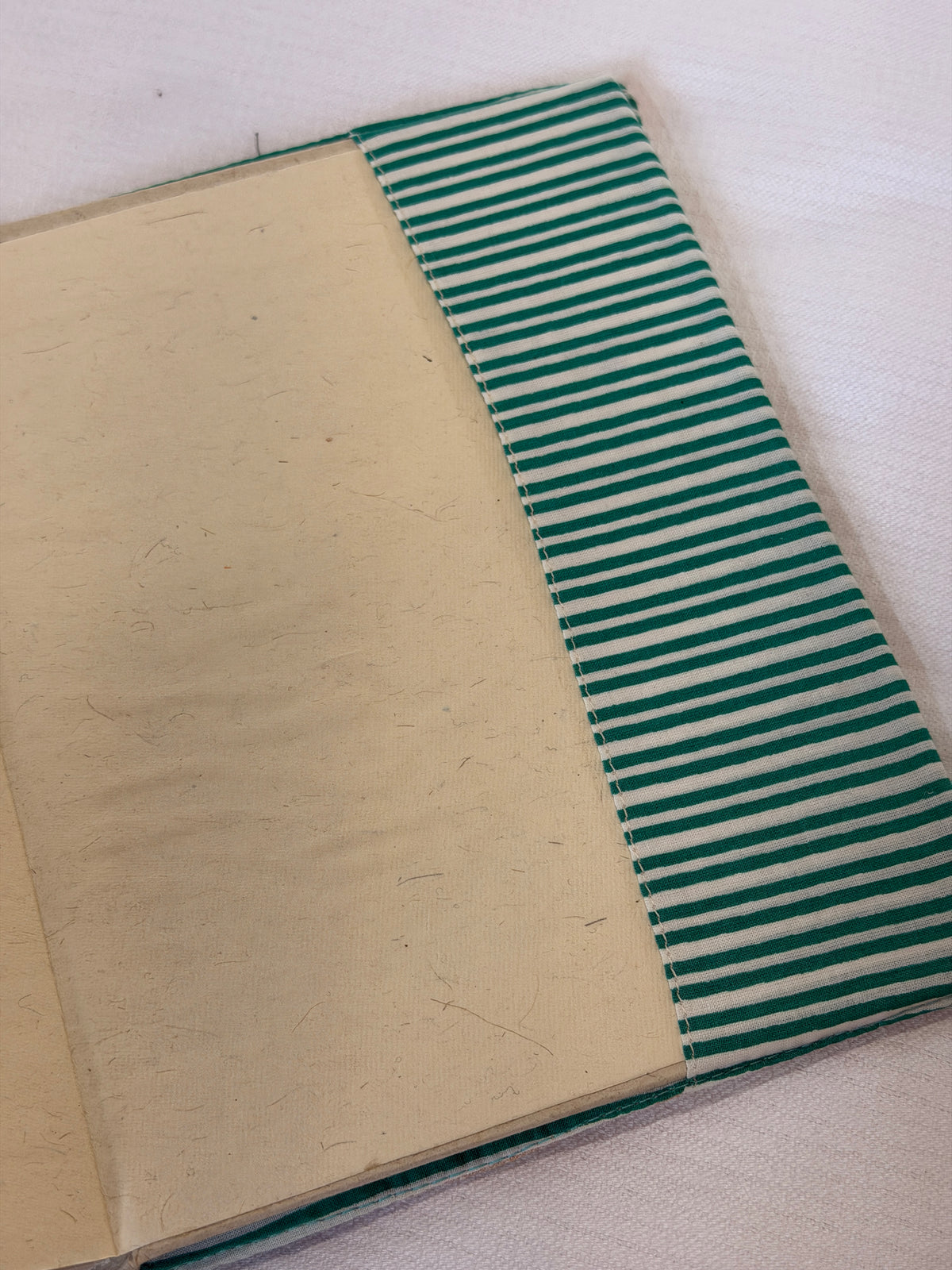 Beige hand embroidered reusable fabric cover / book sleeve with journal notebook inside