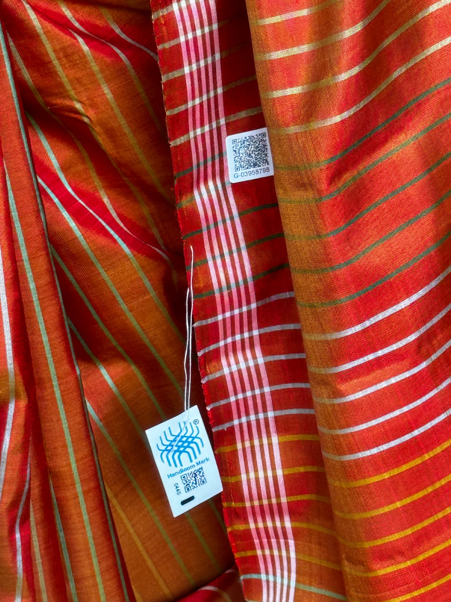 Orange pure silk handloom kanjeevaram pattu saree with multi colored stripes all over