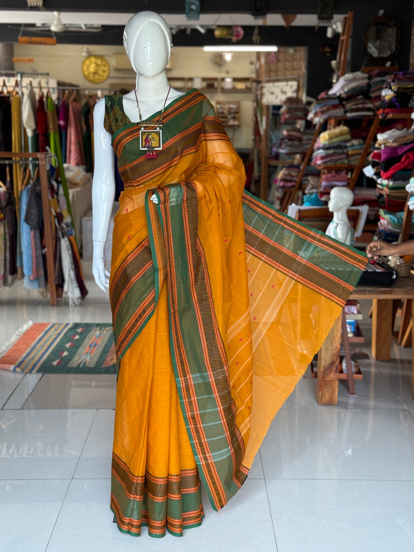 Mustard yellow and green Chettinad cotton handloom saree with butis all over and wide borders