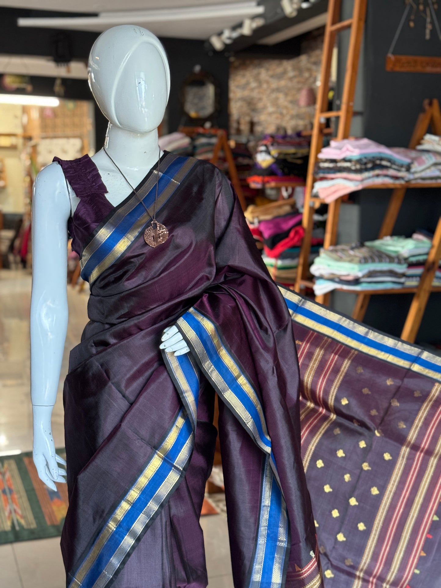 Deep burgundy shade pure silk handloom Kumbakonam pattu saree with blue border and a beautiful palla