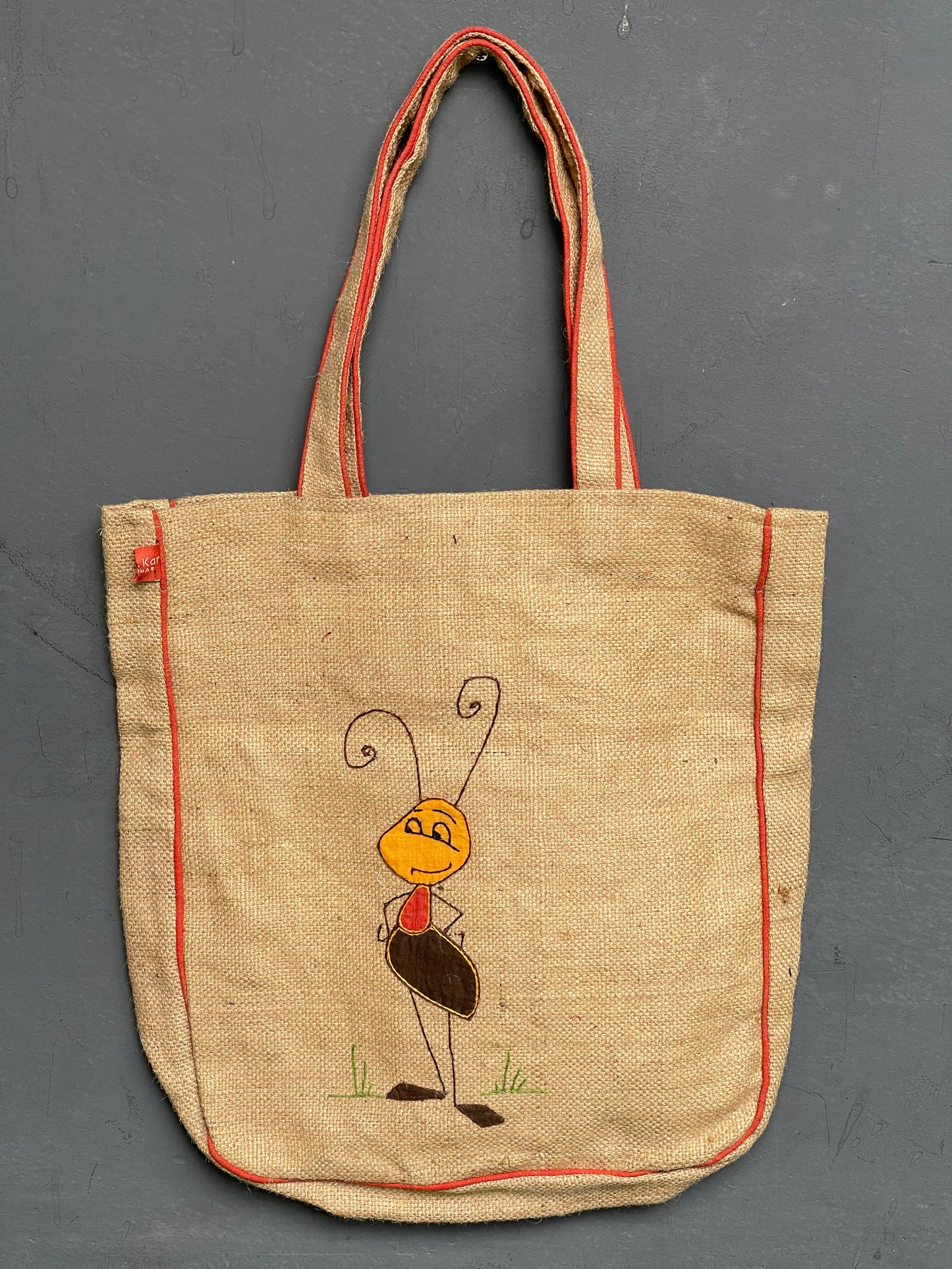 Jute ant design hand embroidered with appliq patch work bag
