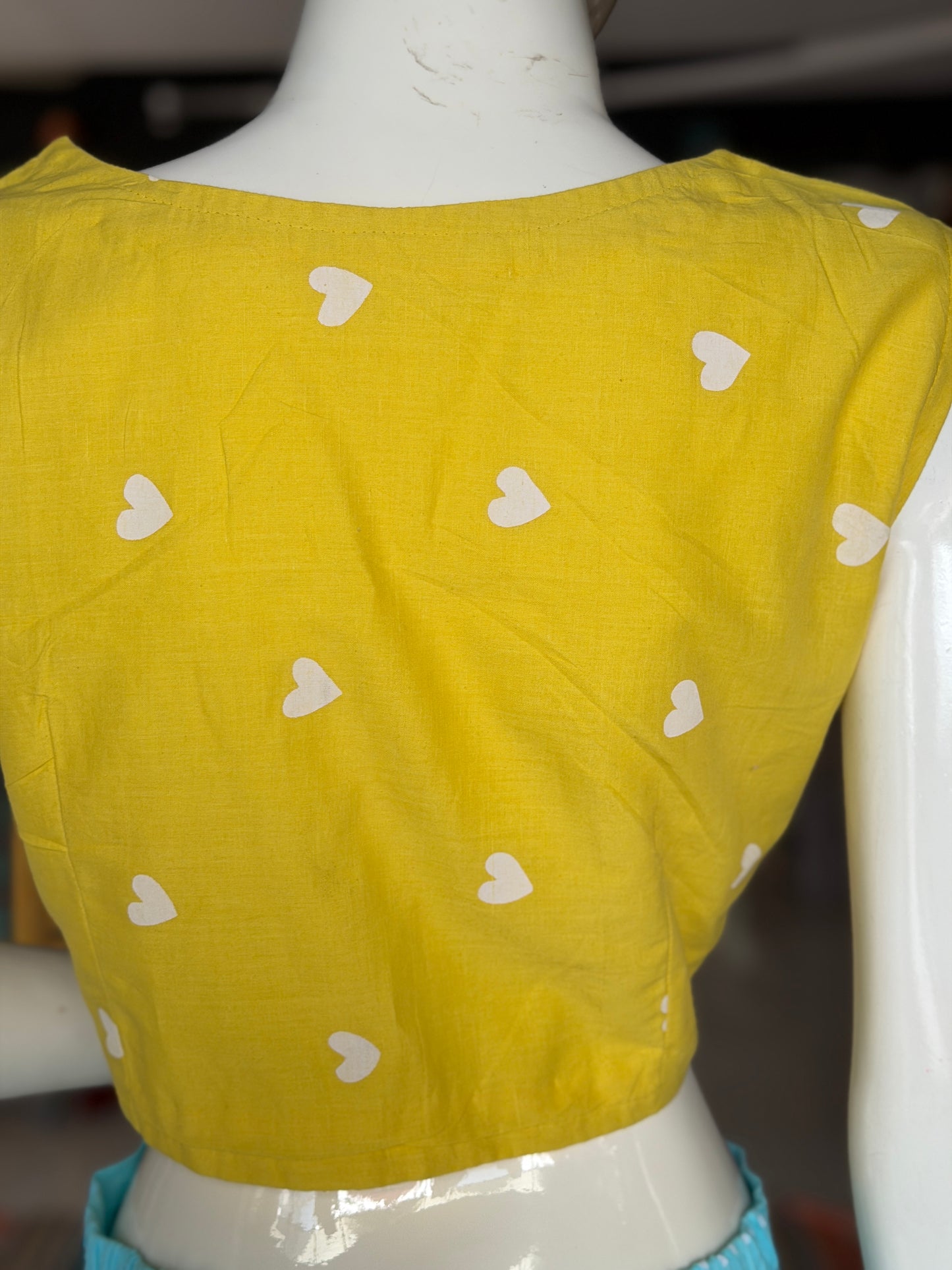 Yellow hearts print sleeveless cotton front open blouse