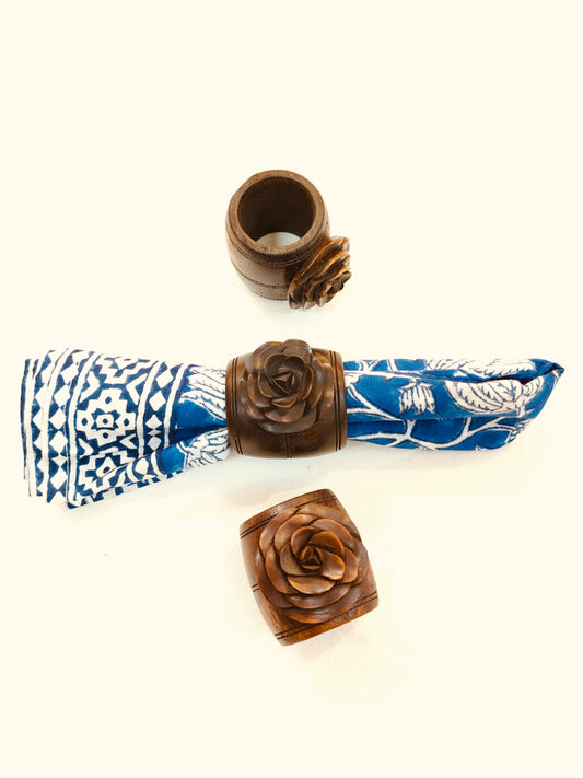 Wooden hand carved napkin ring with a beautiful carved rose on top