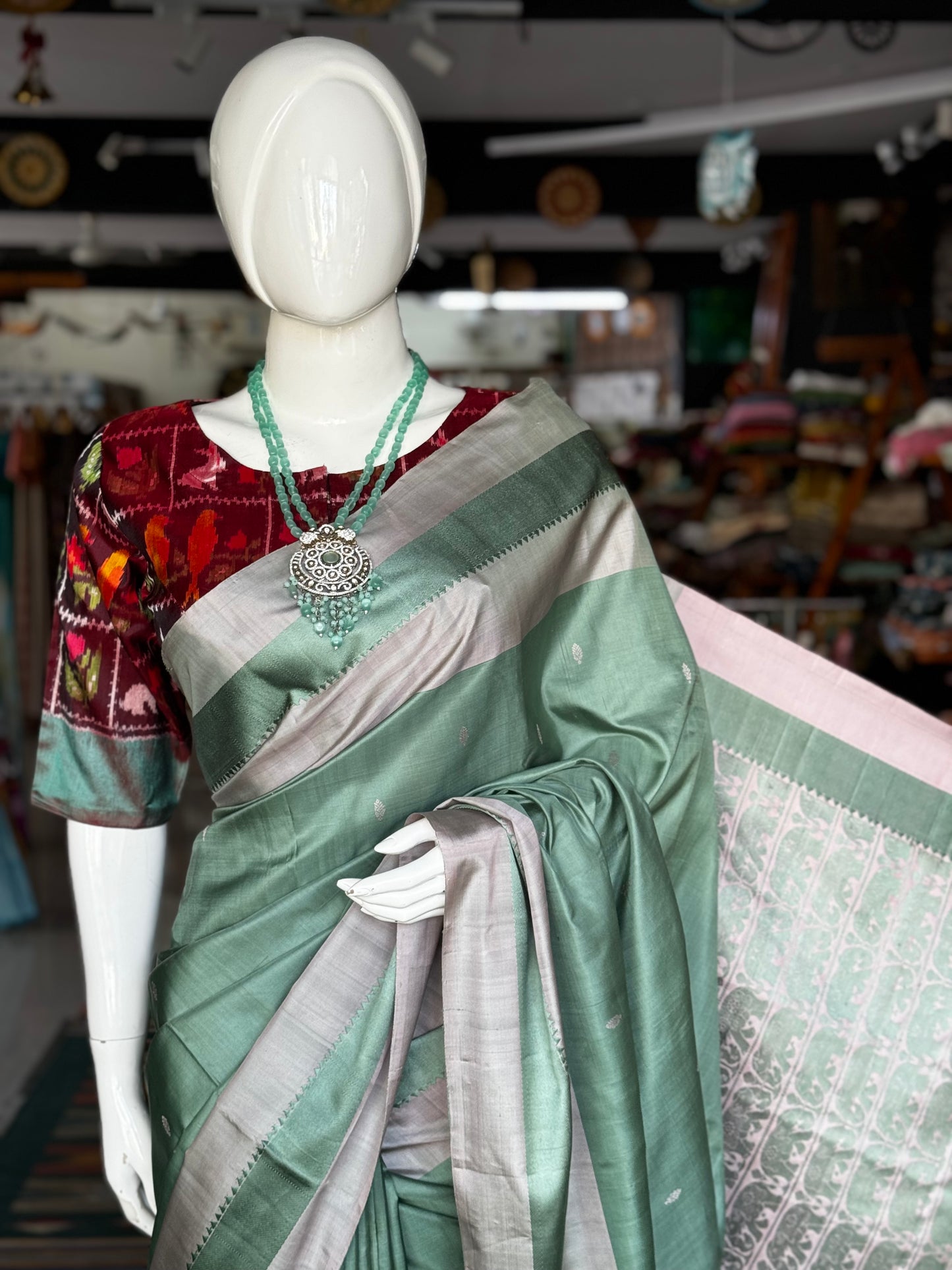 Green pure silk Kodiyala handloom saree with all over butis and light pink palla