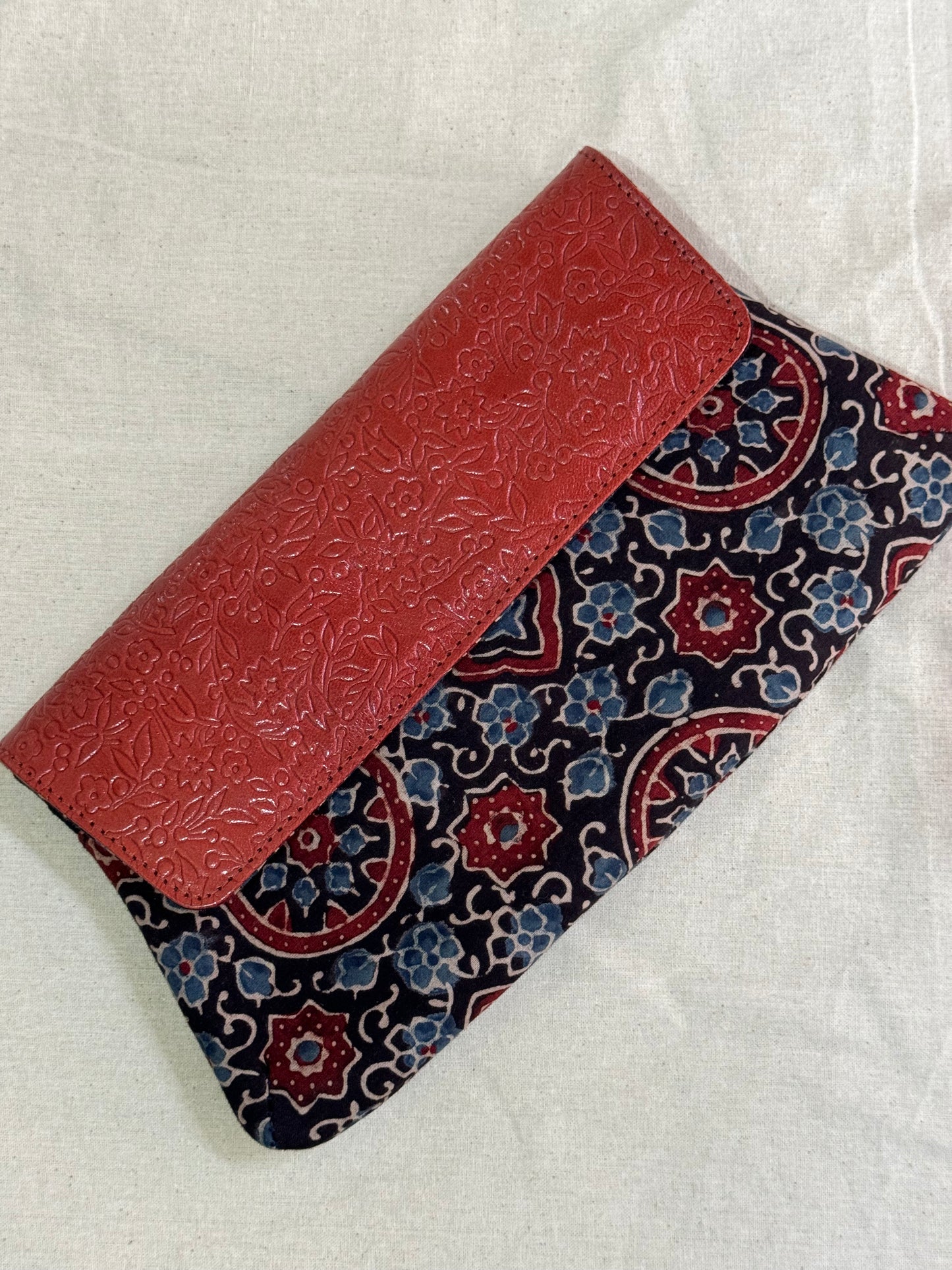 Leather hand embossed flap purse / clutch with hand block printed fabric base