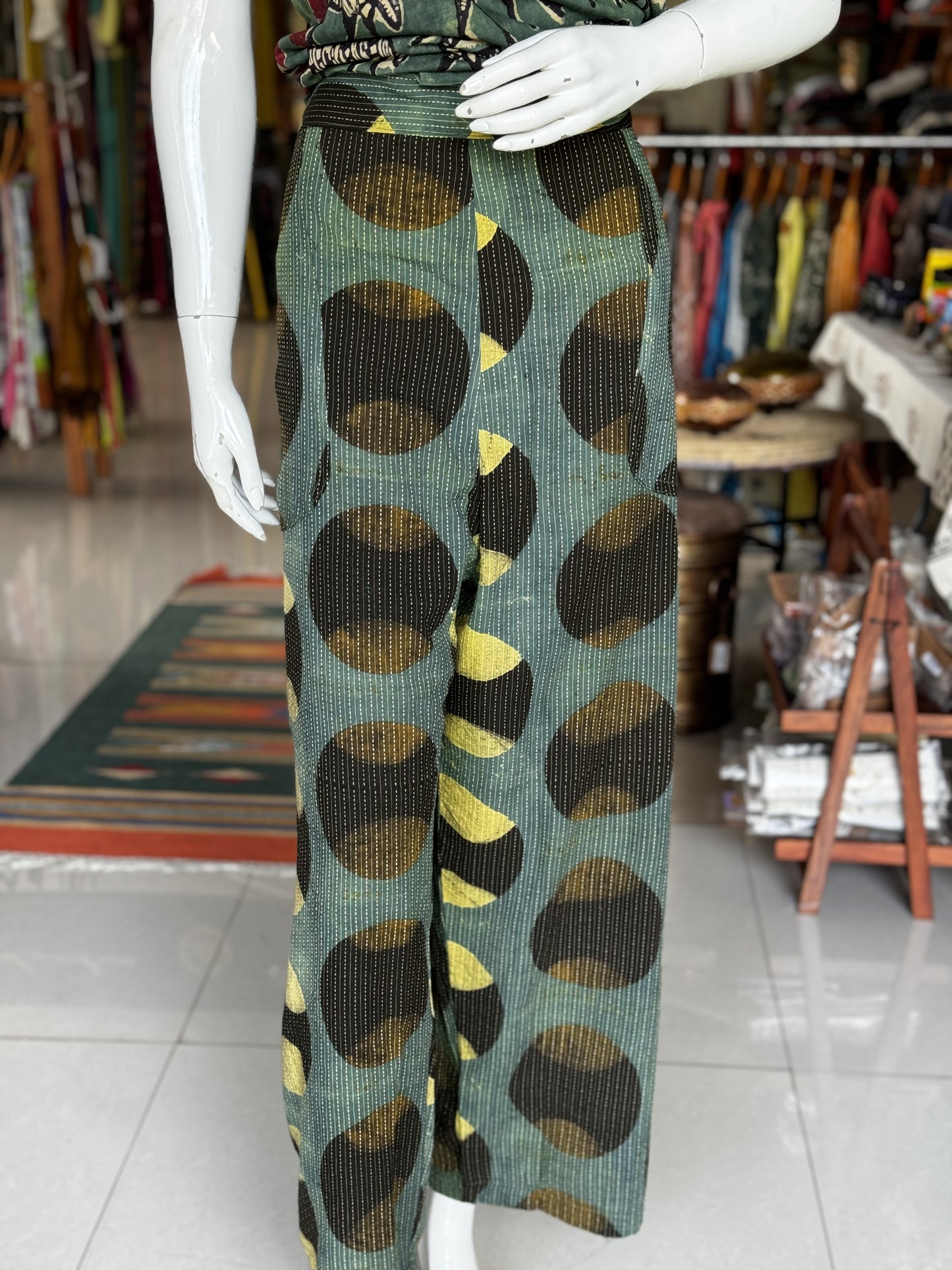 Green cotton hand block printed pants with black and yellow circular Ajrakh hand block prints