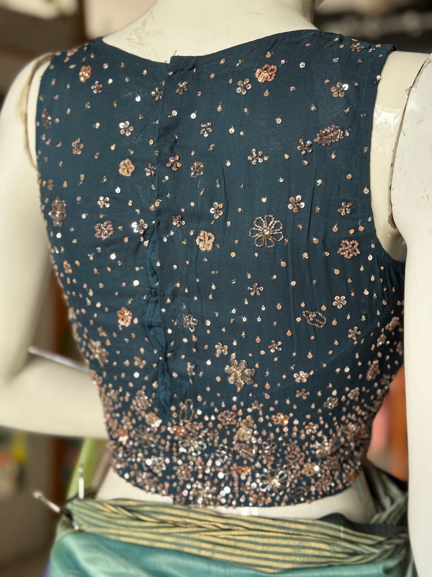 Teal hand embroidered georgette sleeveless blouse with work on front and back