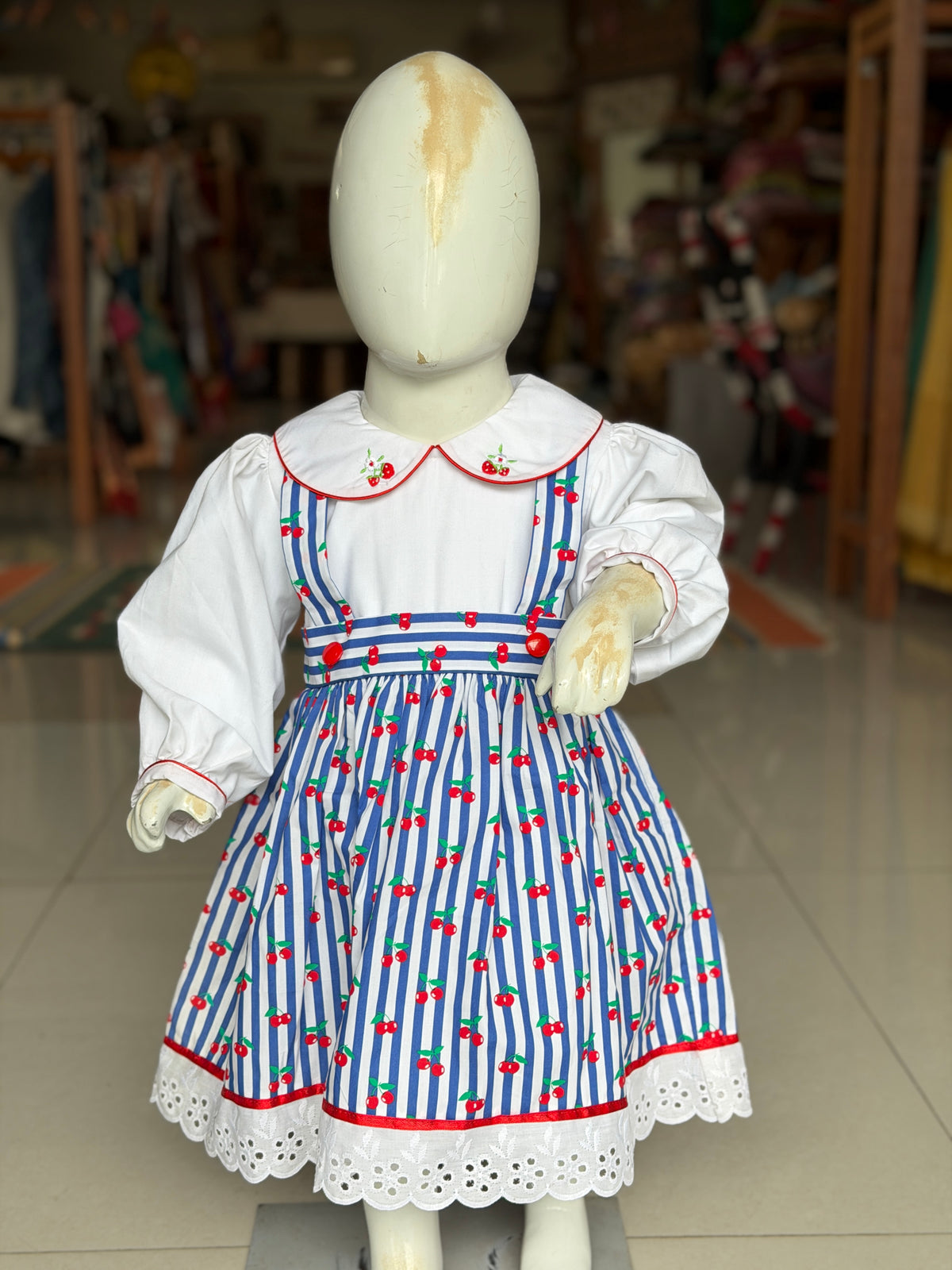 Blue and white stripes cherries print suspender look cotton frock with attached white  embroidered collared top for girls