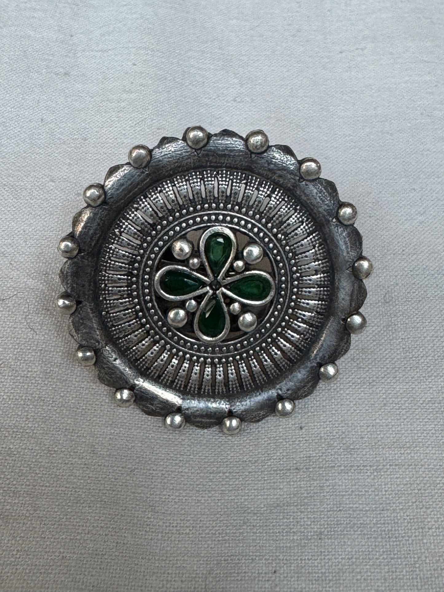 Green stones in the center - oversized brass finger ring with silver finish