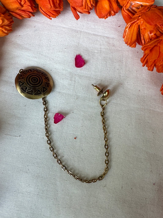 One ear wonder - Brass and copper sun design clip on plus stud with a connecting chain
